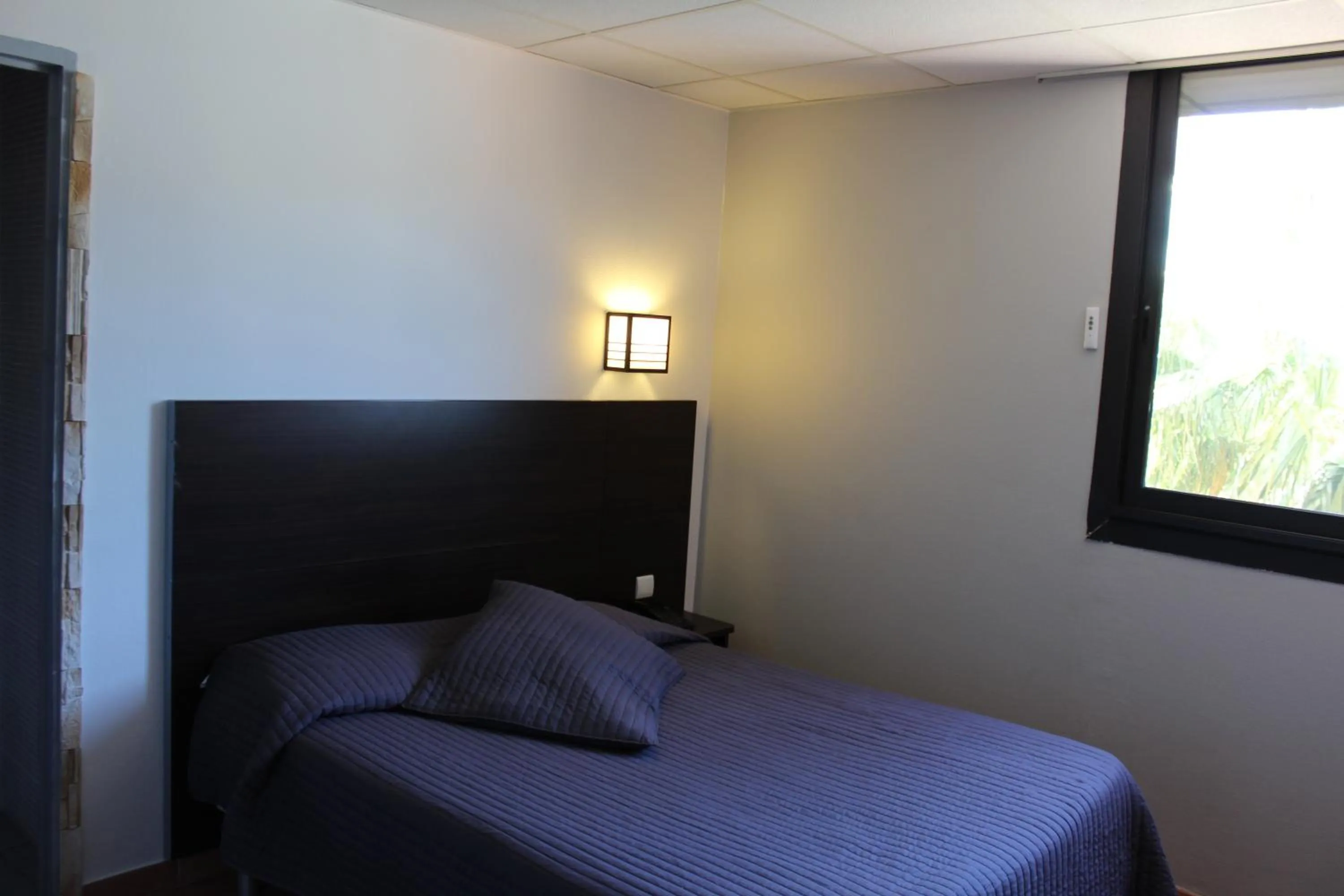 Bed in Hôtel L'Hacienda