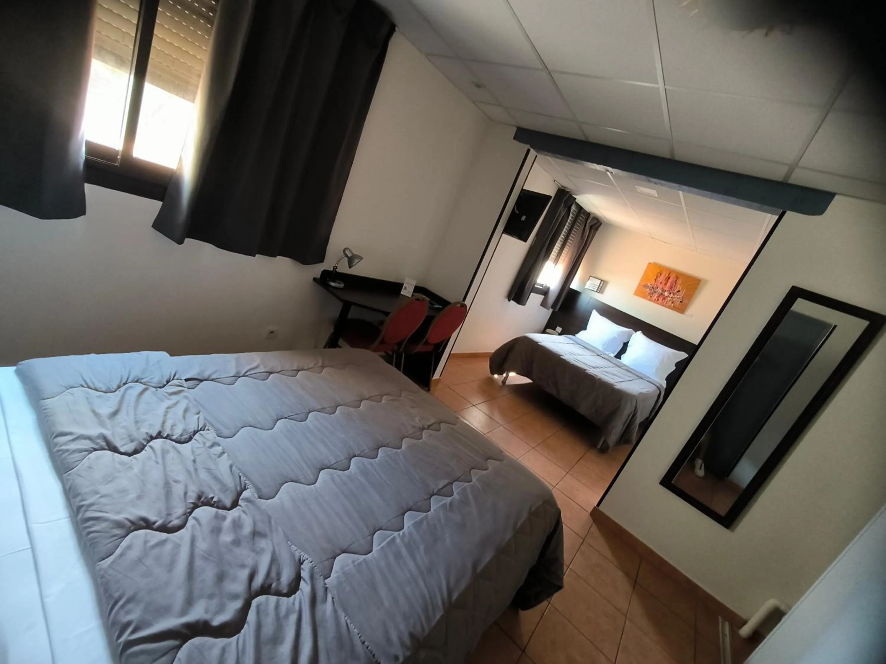 Bed in Hôtel L'Hacienda