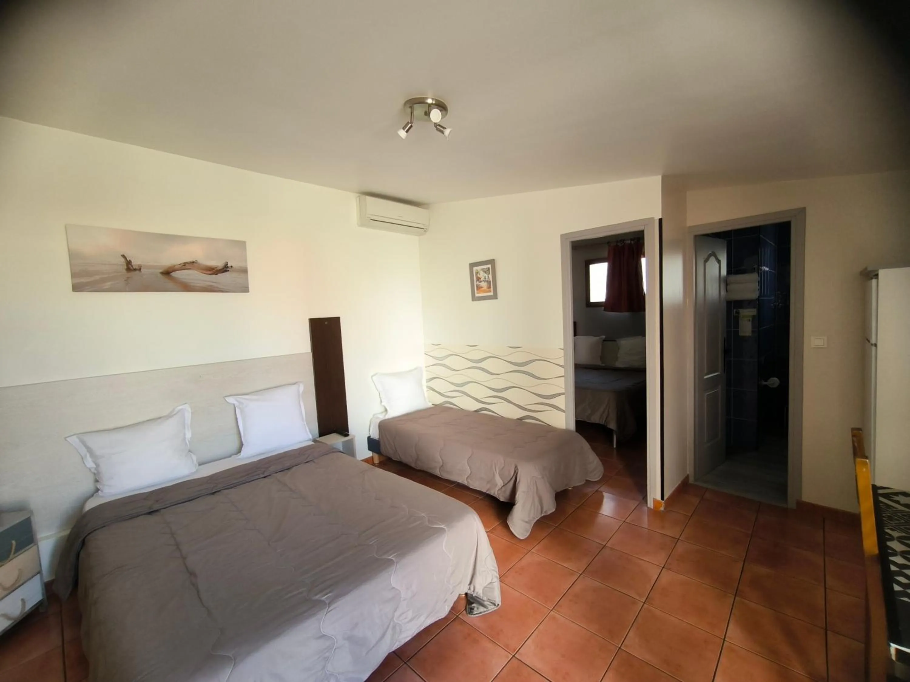 Bed in Hôtel L'Hacienda