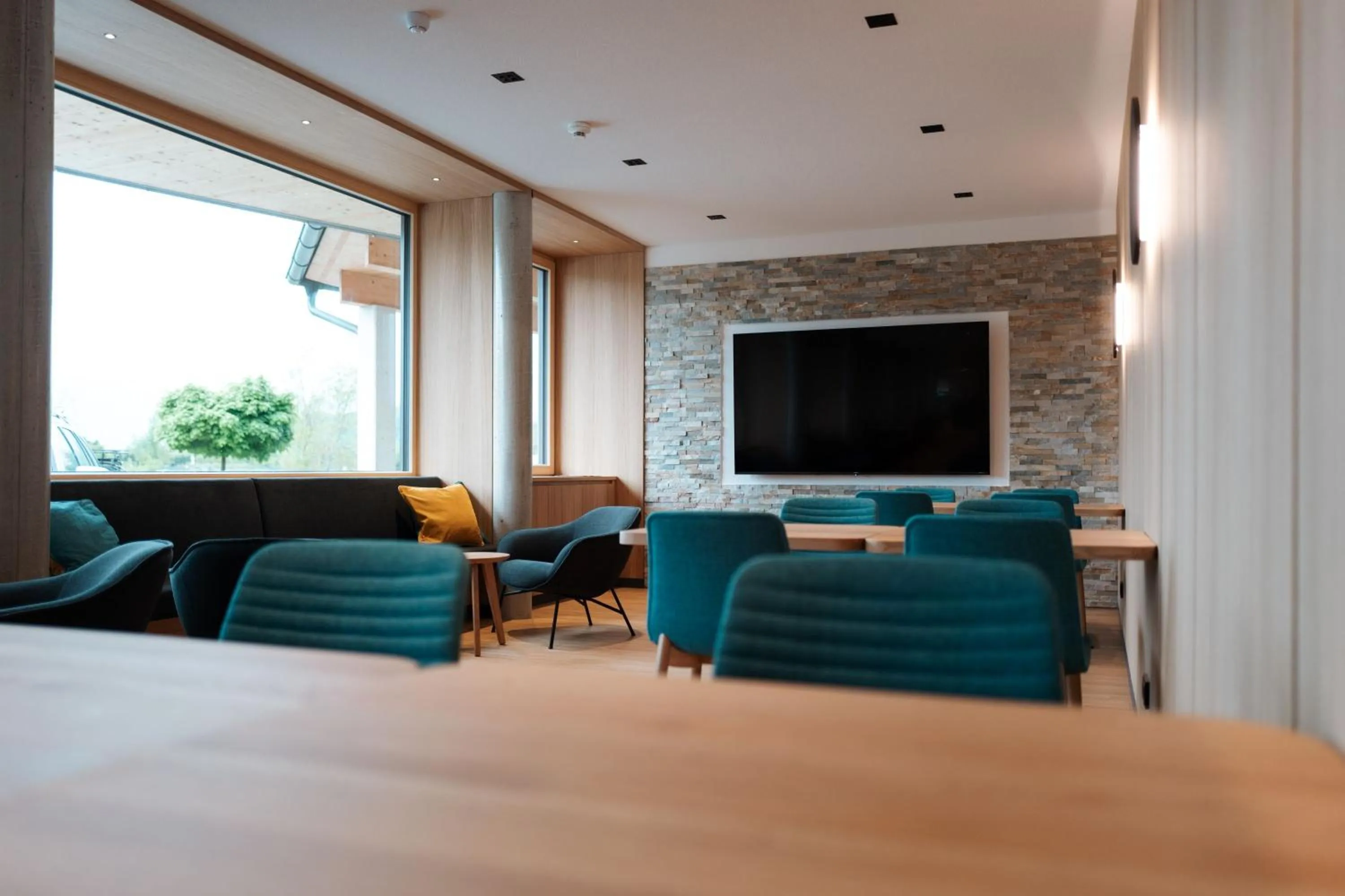 Communal lounge/ TV room in eduCARE Hotel