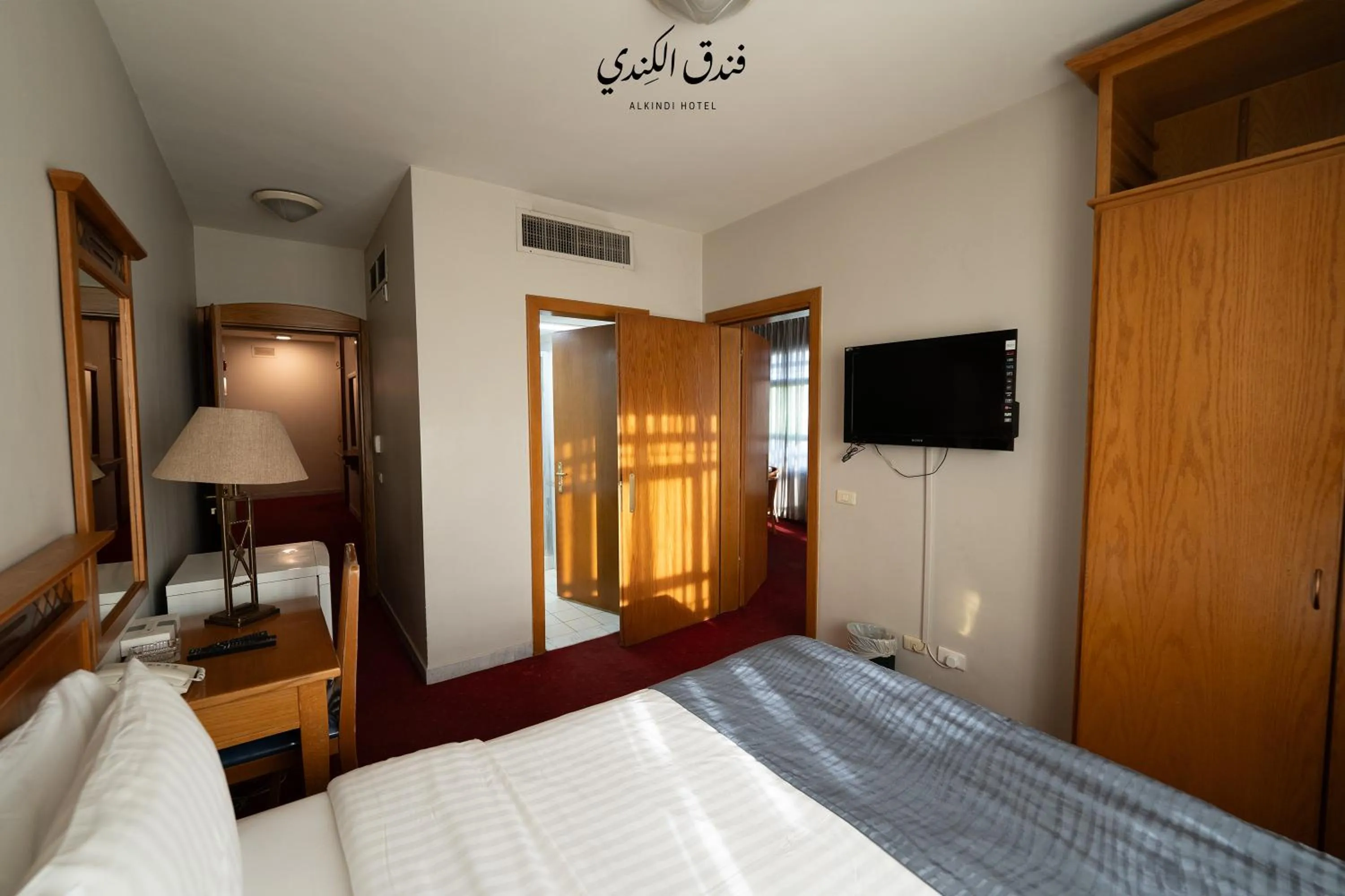 Communal lounge/ TV room, Bed in Kindi Suite Hotel