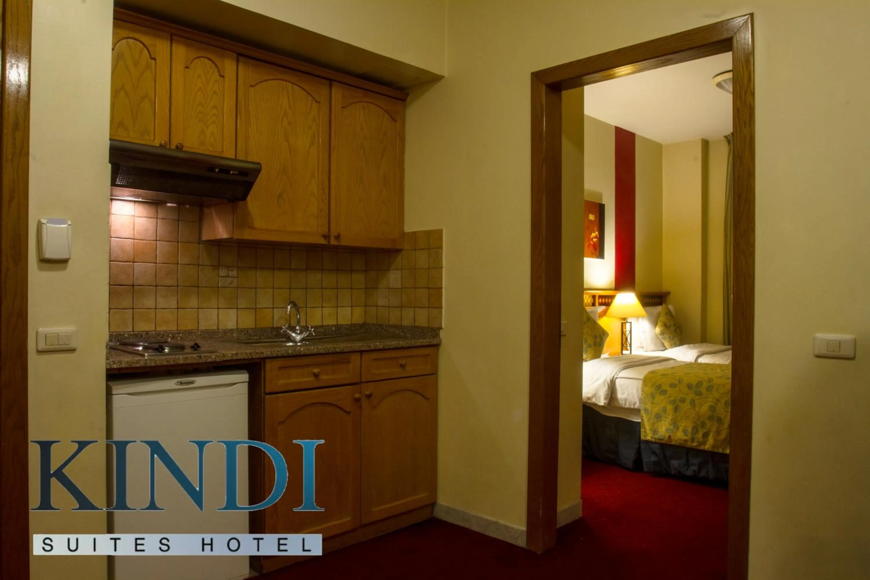 Kitchen or kitchenette, Bed in Kindi Suite Hotel
