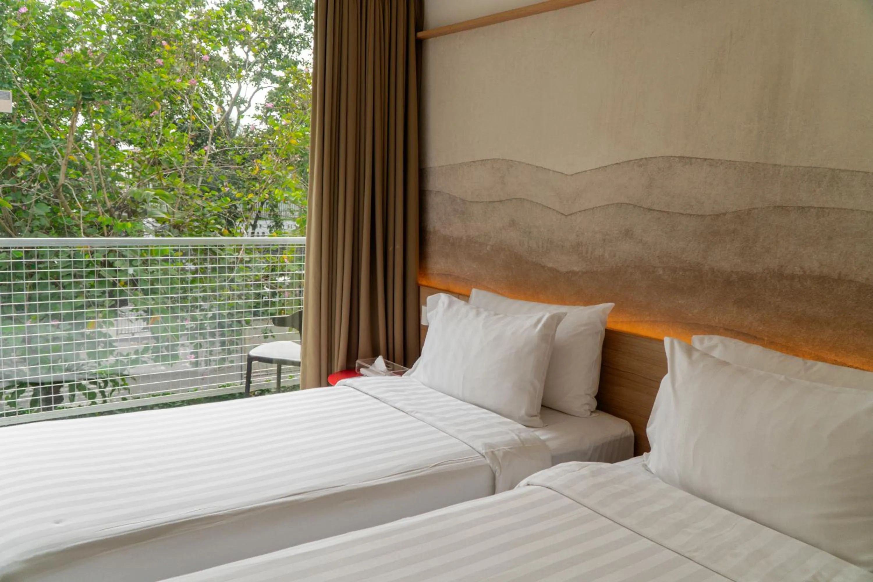 Bed in Malaka Hotel Bandung