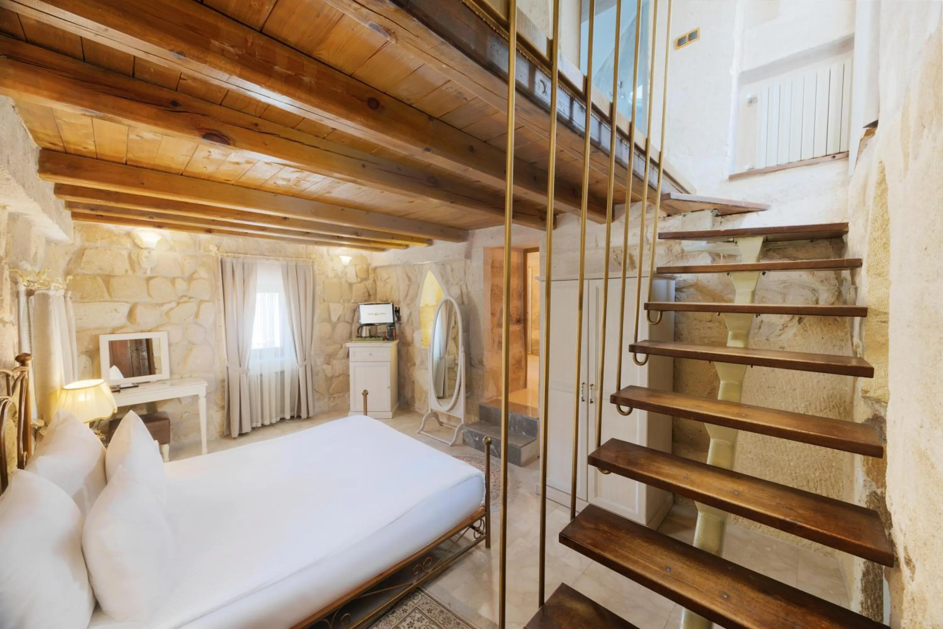 Photo of the whole room, Bed in Tafoni Houses Cave Hotel