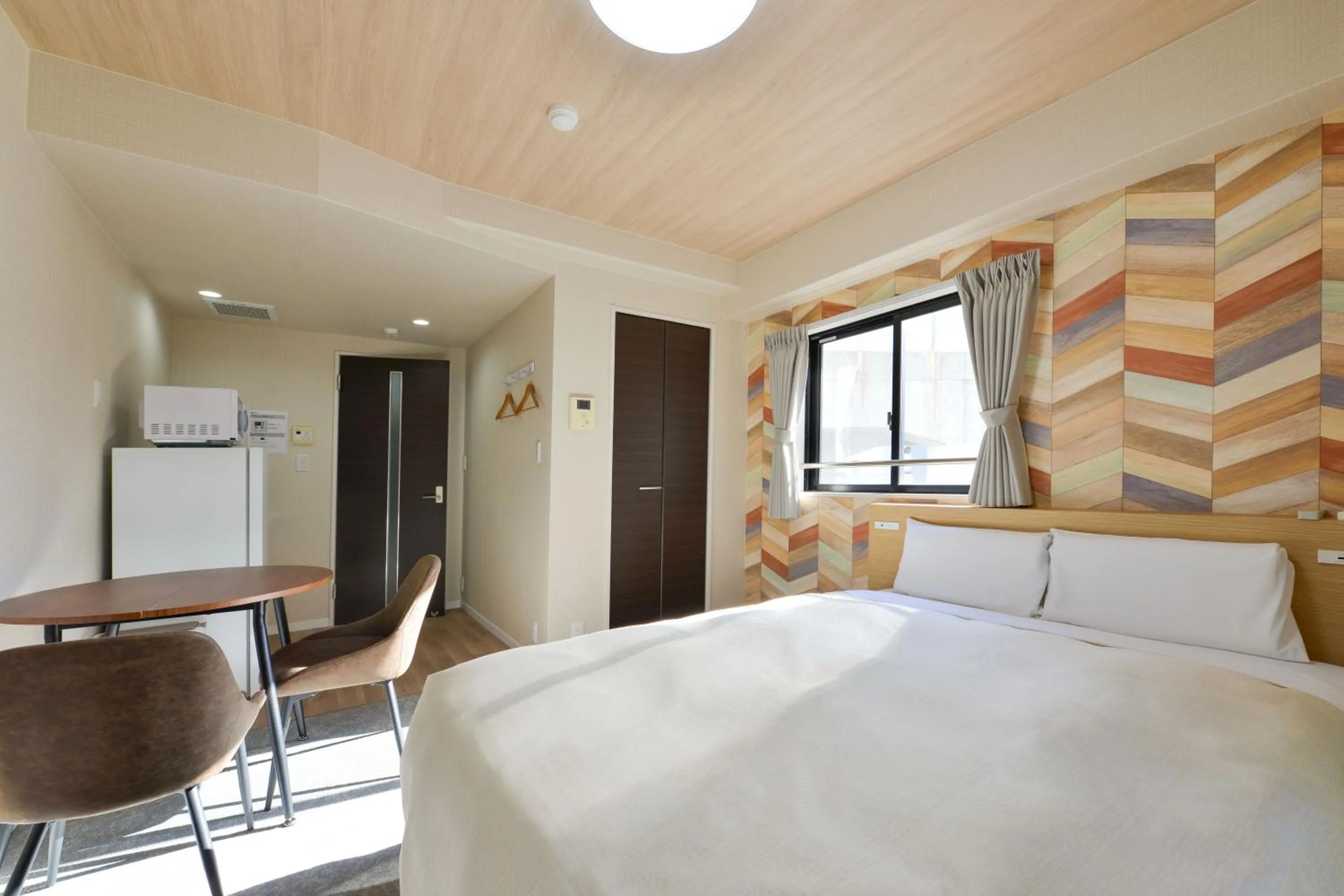 Photo of the whole room, Bed in Hotel New Gaea Yakuin