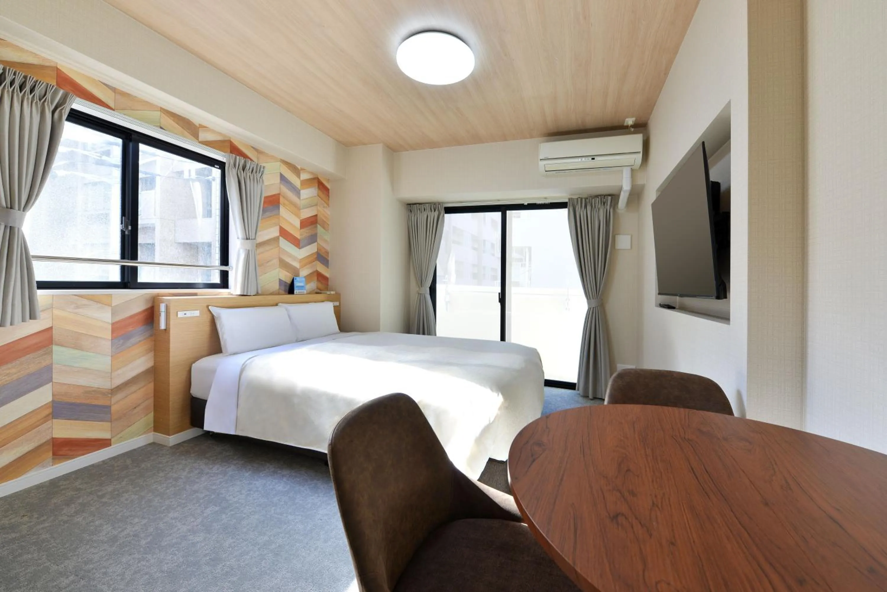 Bed in Hotel New Gaea Yakuin