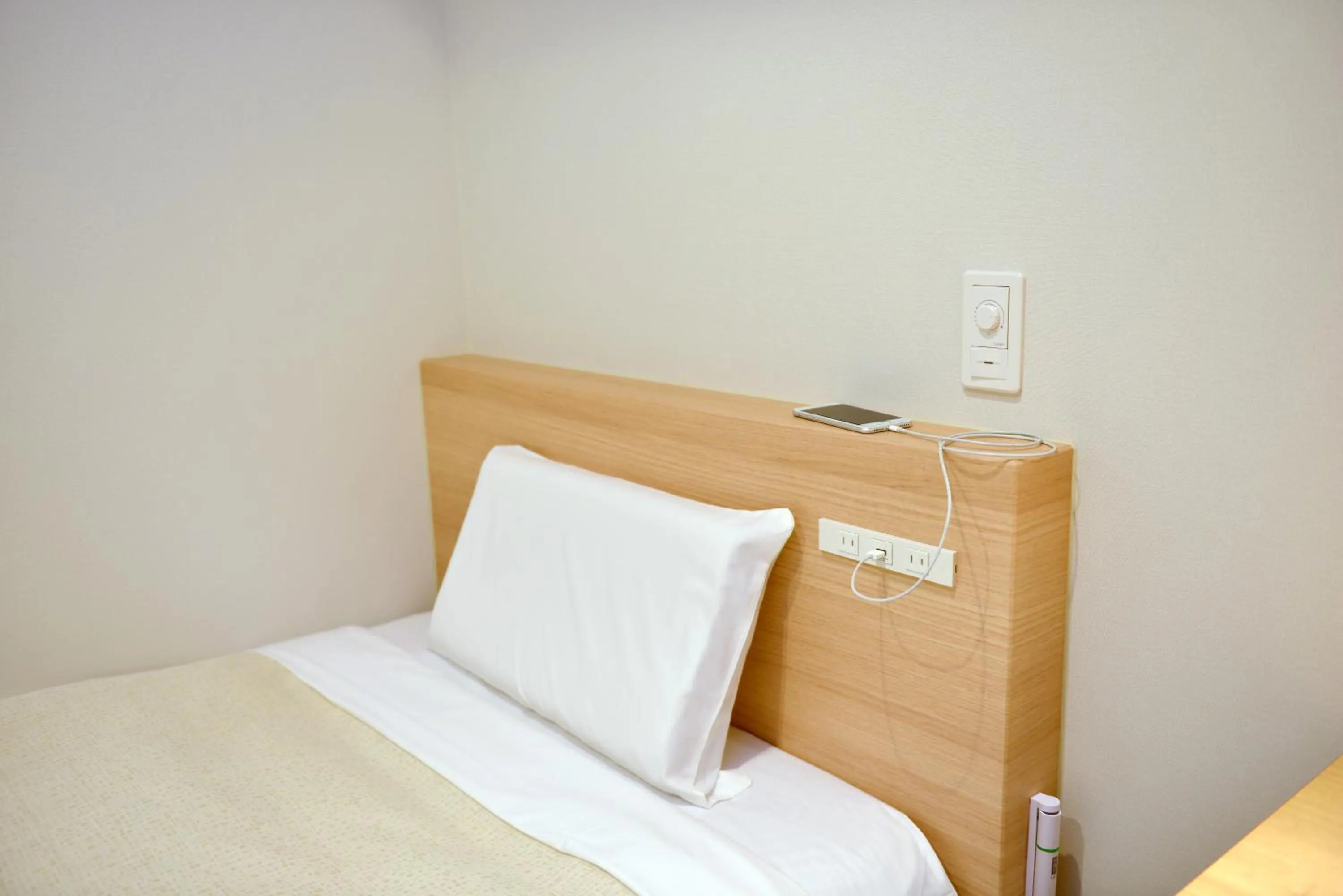 Bed in Hotel New Gaea Yakuin