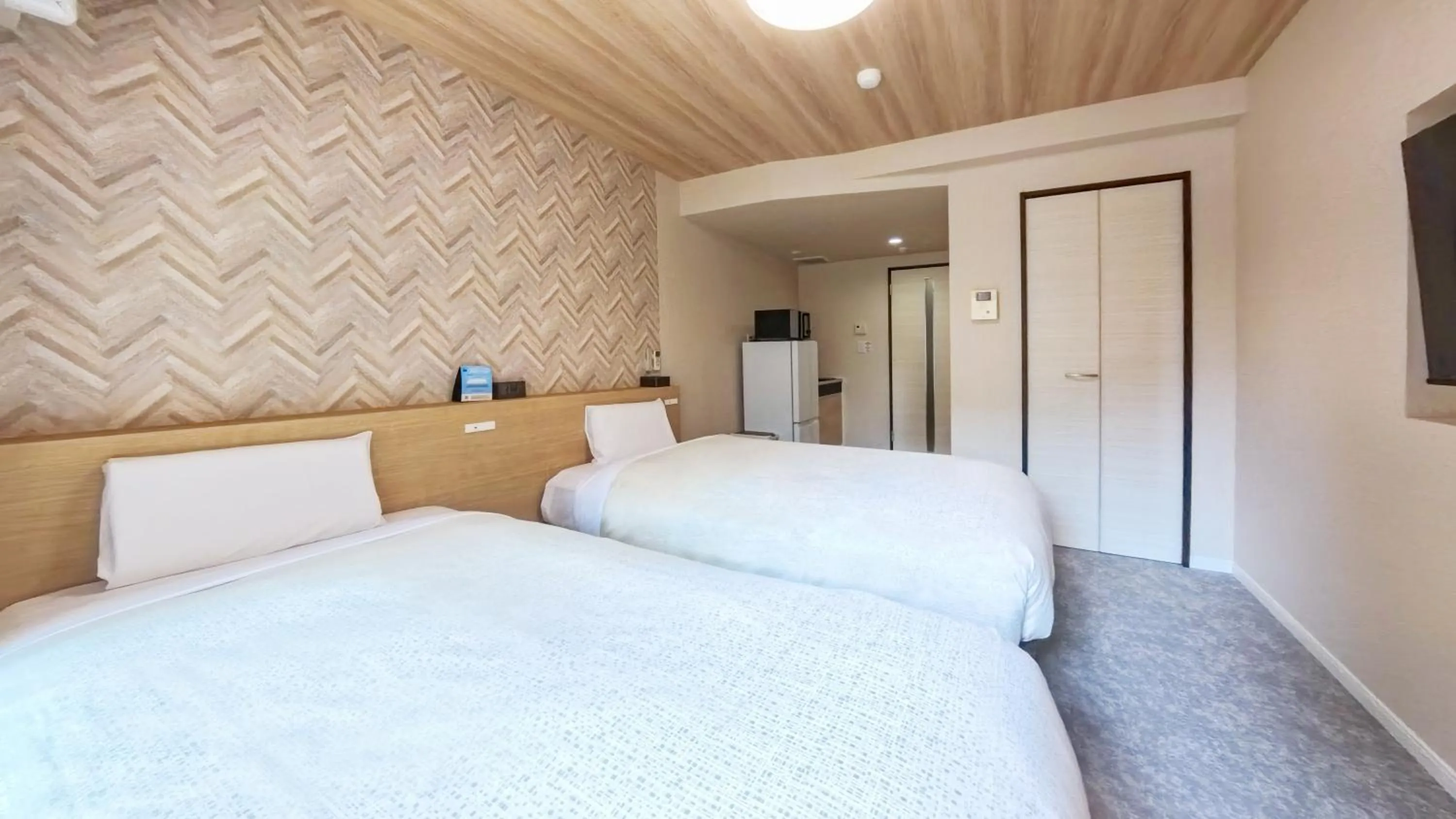 Bed in Hotel New Gaea Yakuin