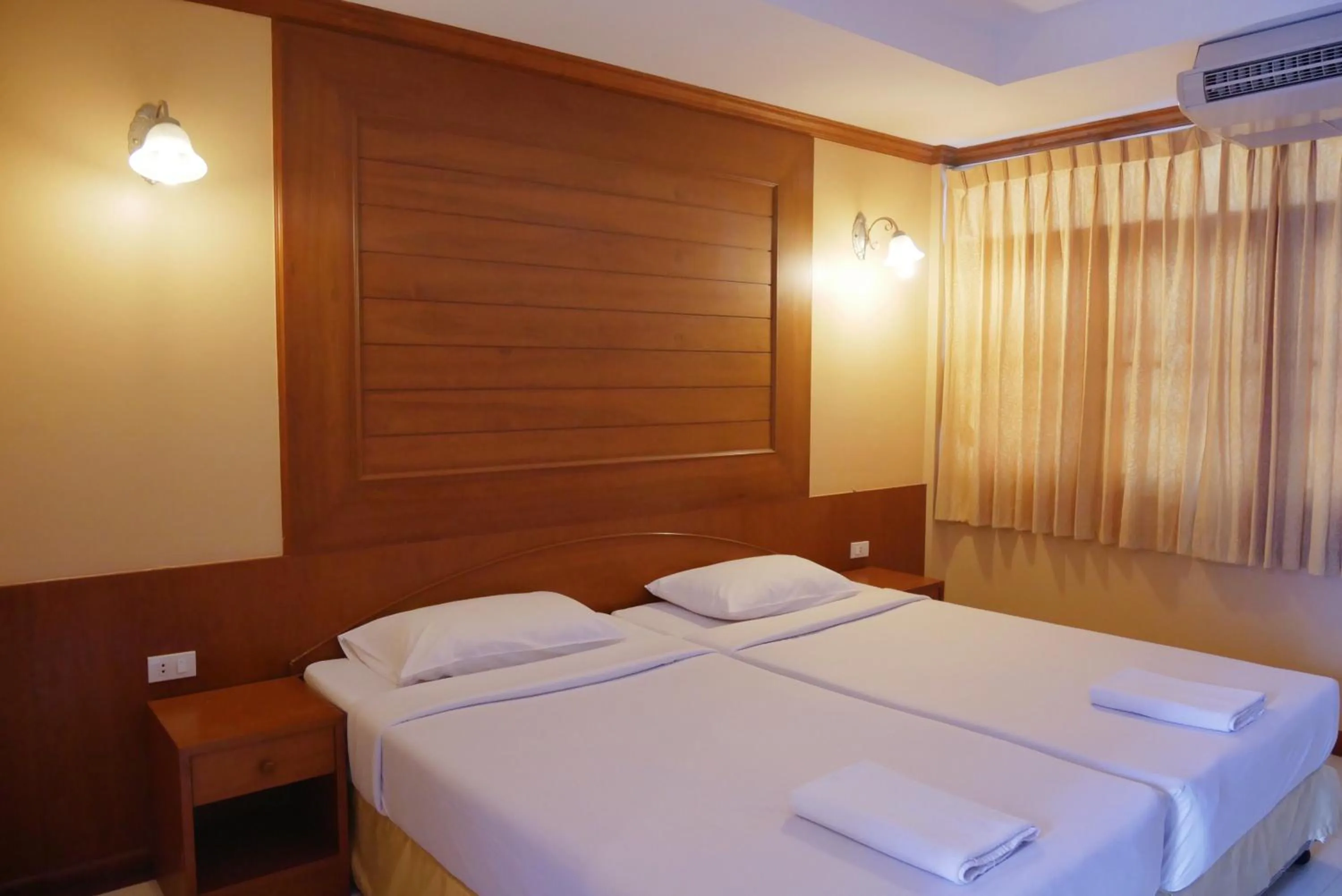 Bed in Baan JPN Hotel
