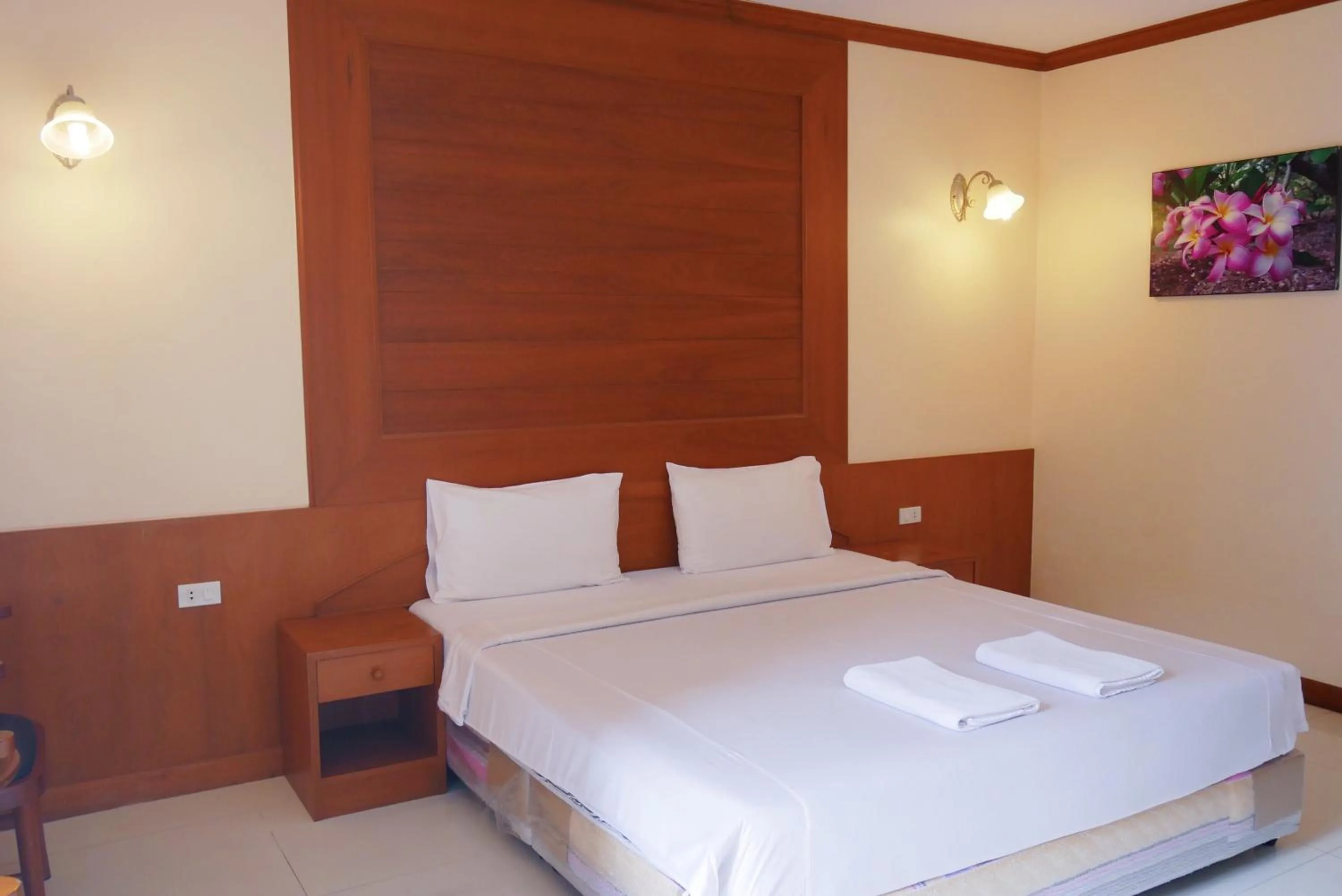 Bed in Baan JPN Hotel