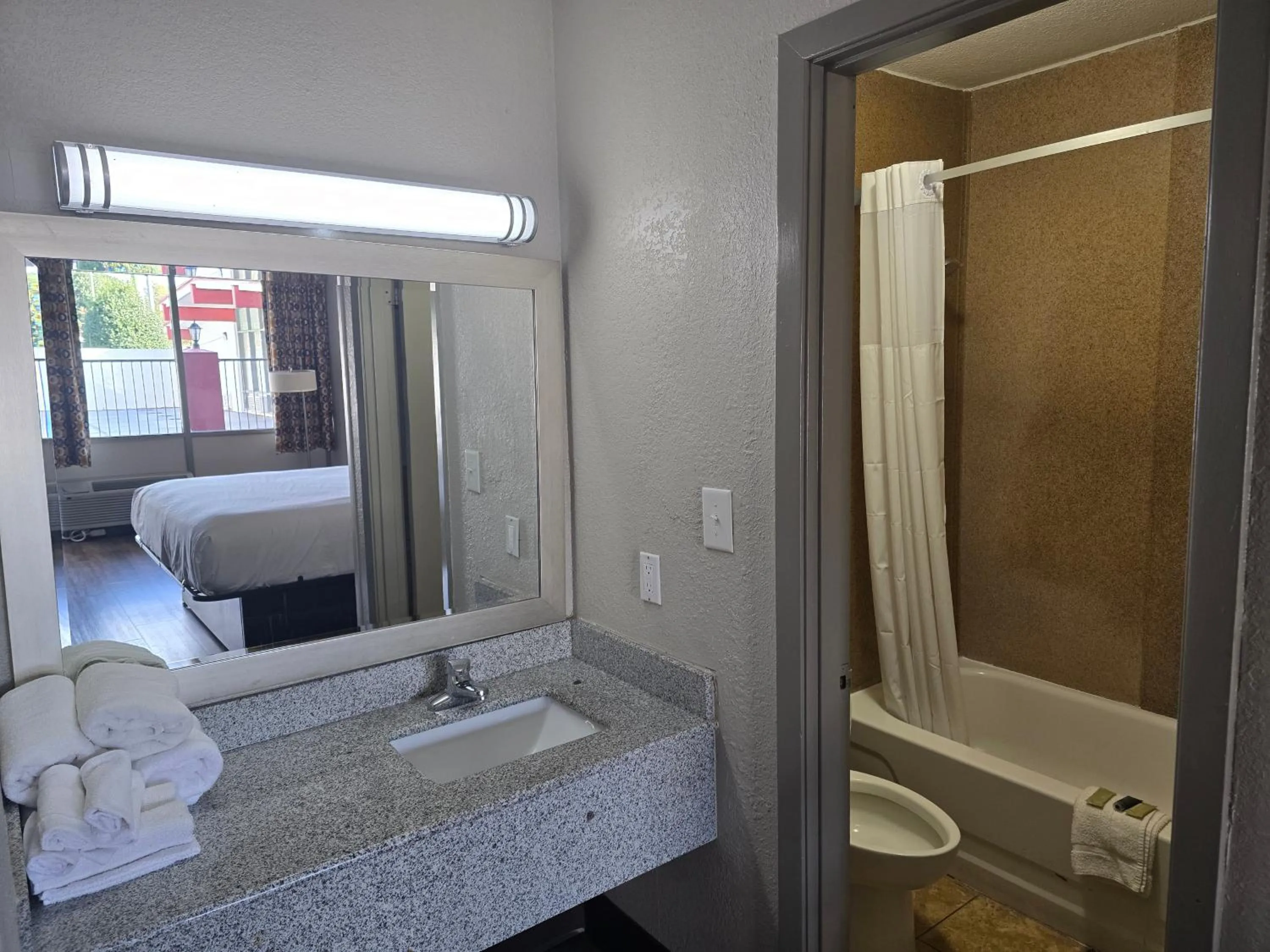 Bathroom in Days Inn by Wyndham Raleigh South