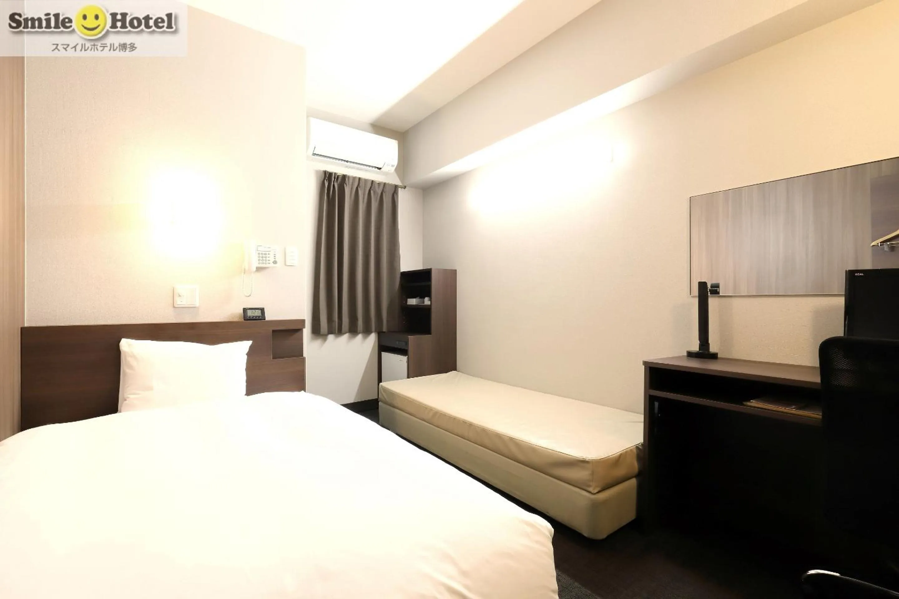 Bed in Smile Hotel Hakata