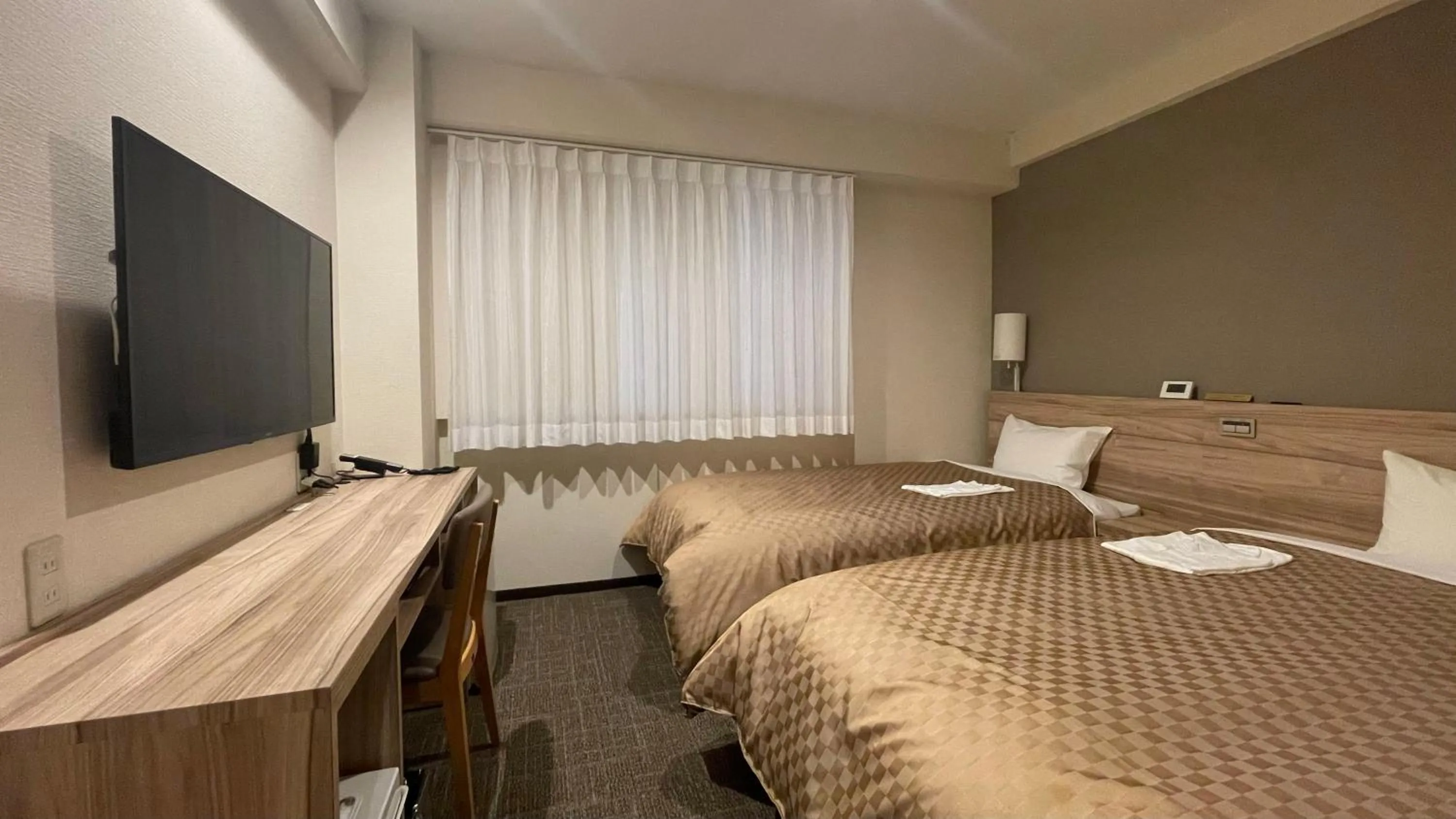 Bed in Kusatsu Daiichi Hotel