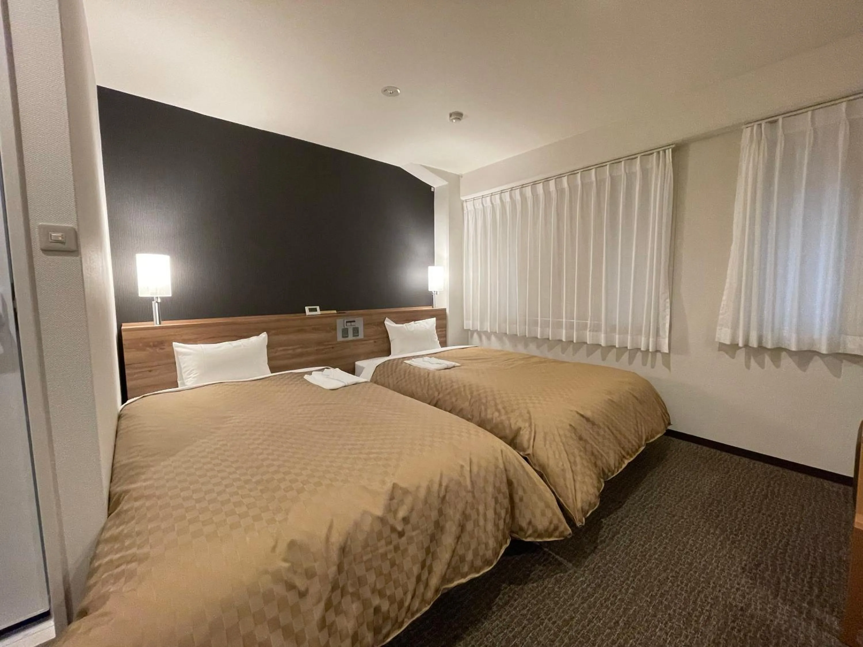 Bed in Kusatsu Daiichi Hotel