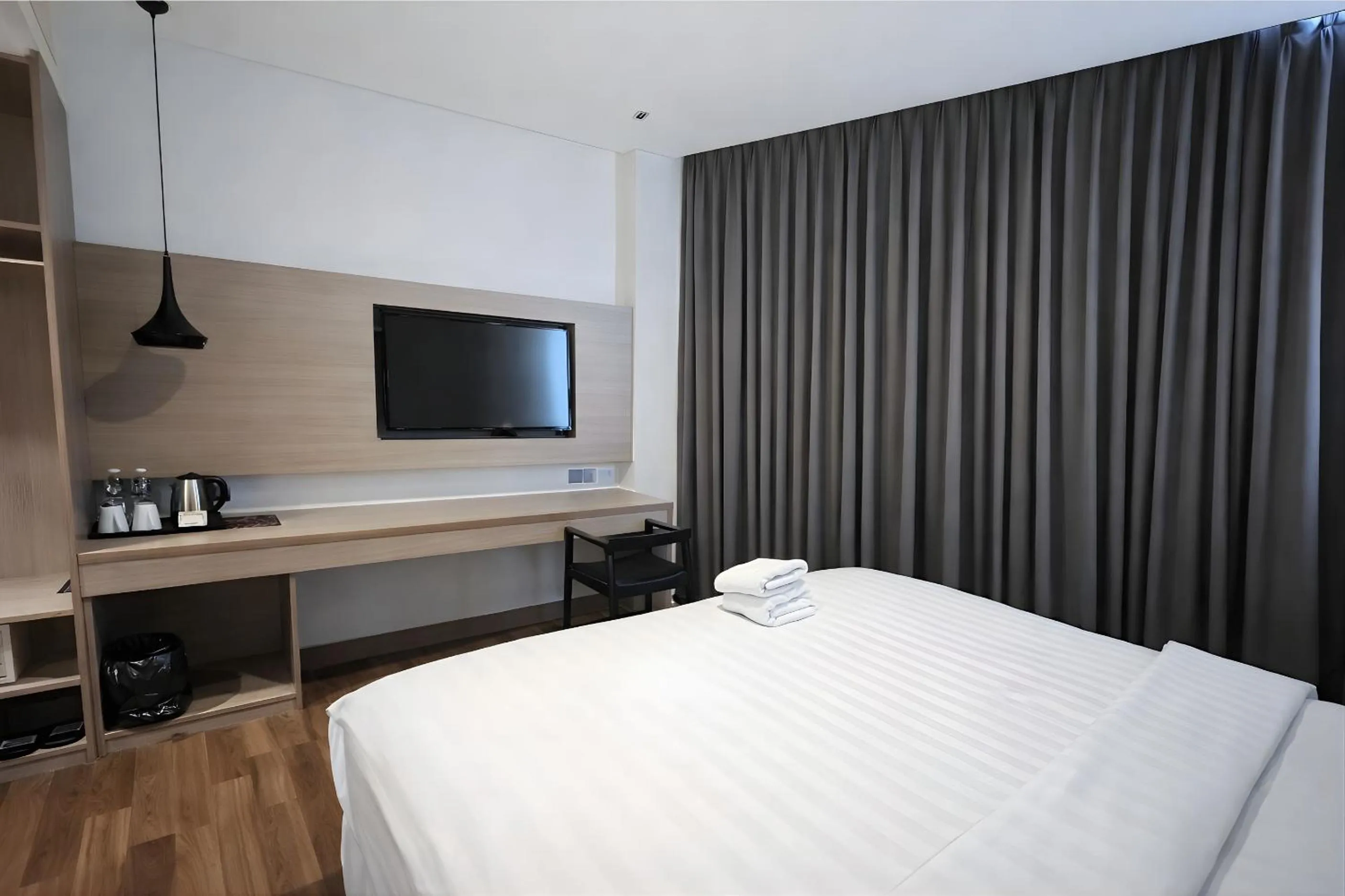 Bed in Rivoli Hotel Jakarta