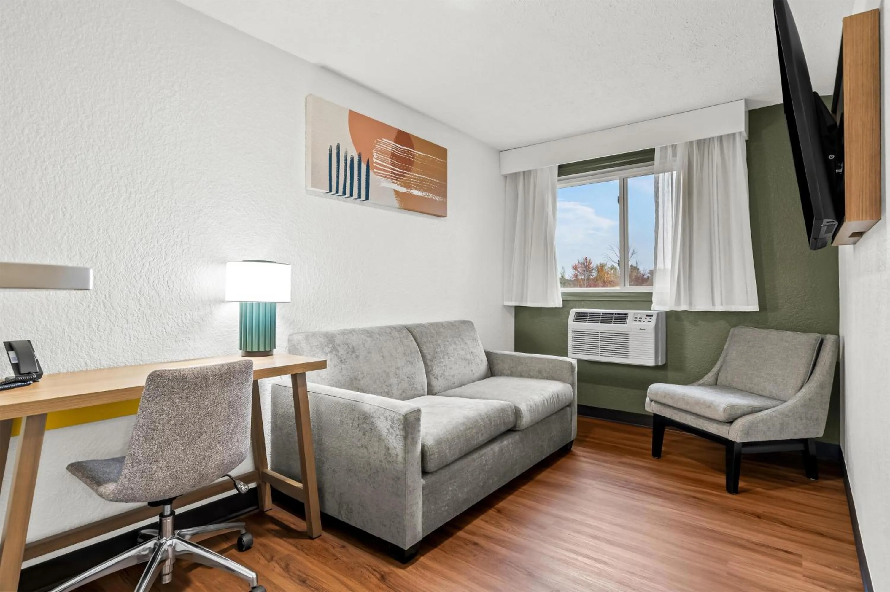 Living room in Spark by Hilton Portland Airport Maine Mall