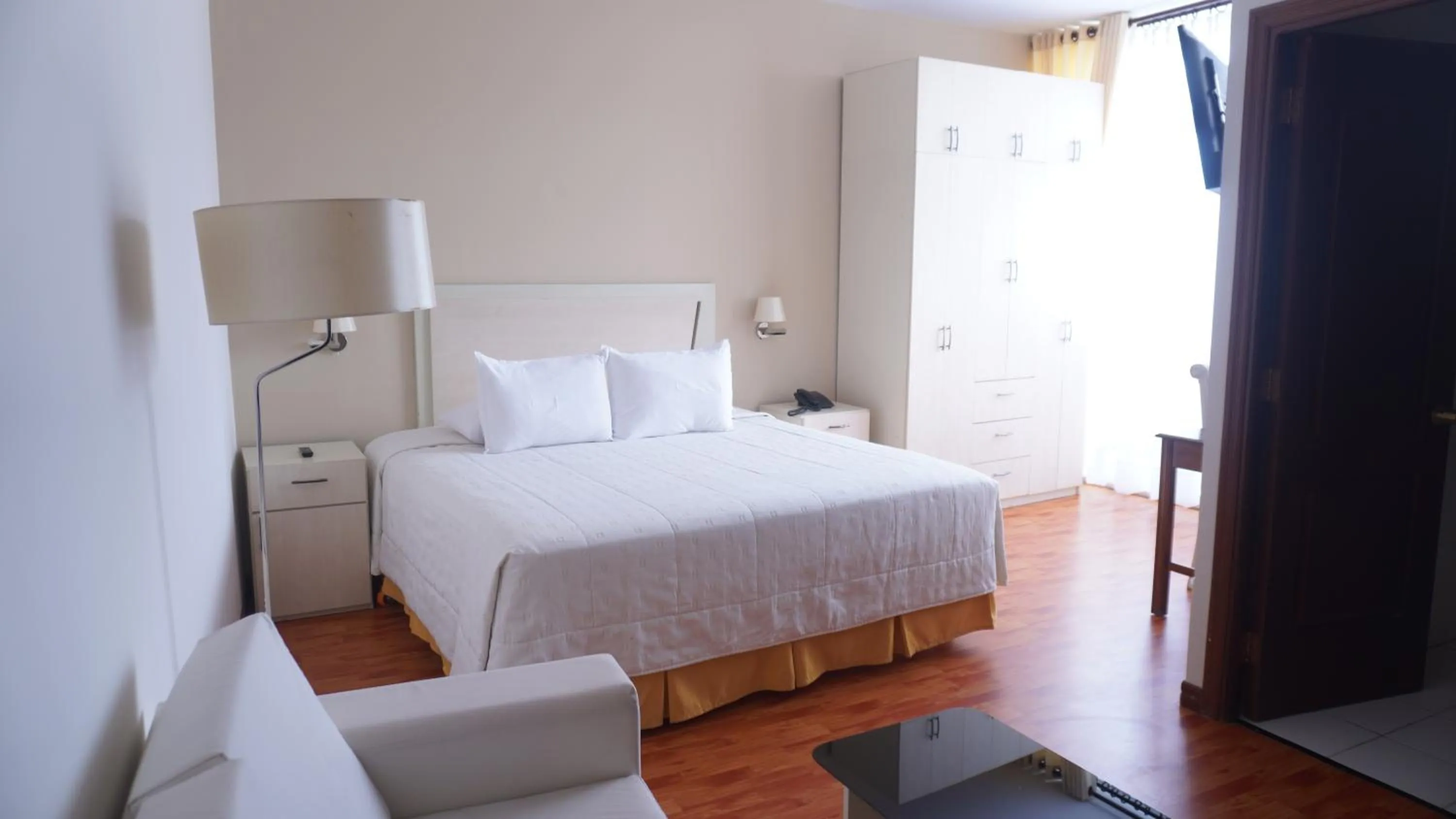 Bed in Delfines Apart Hotel