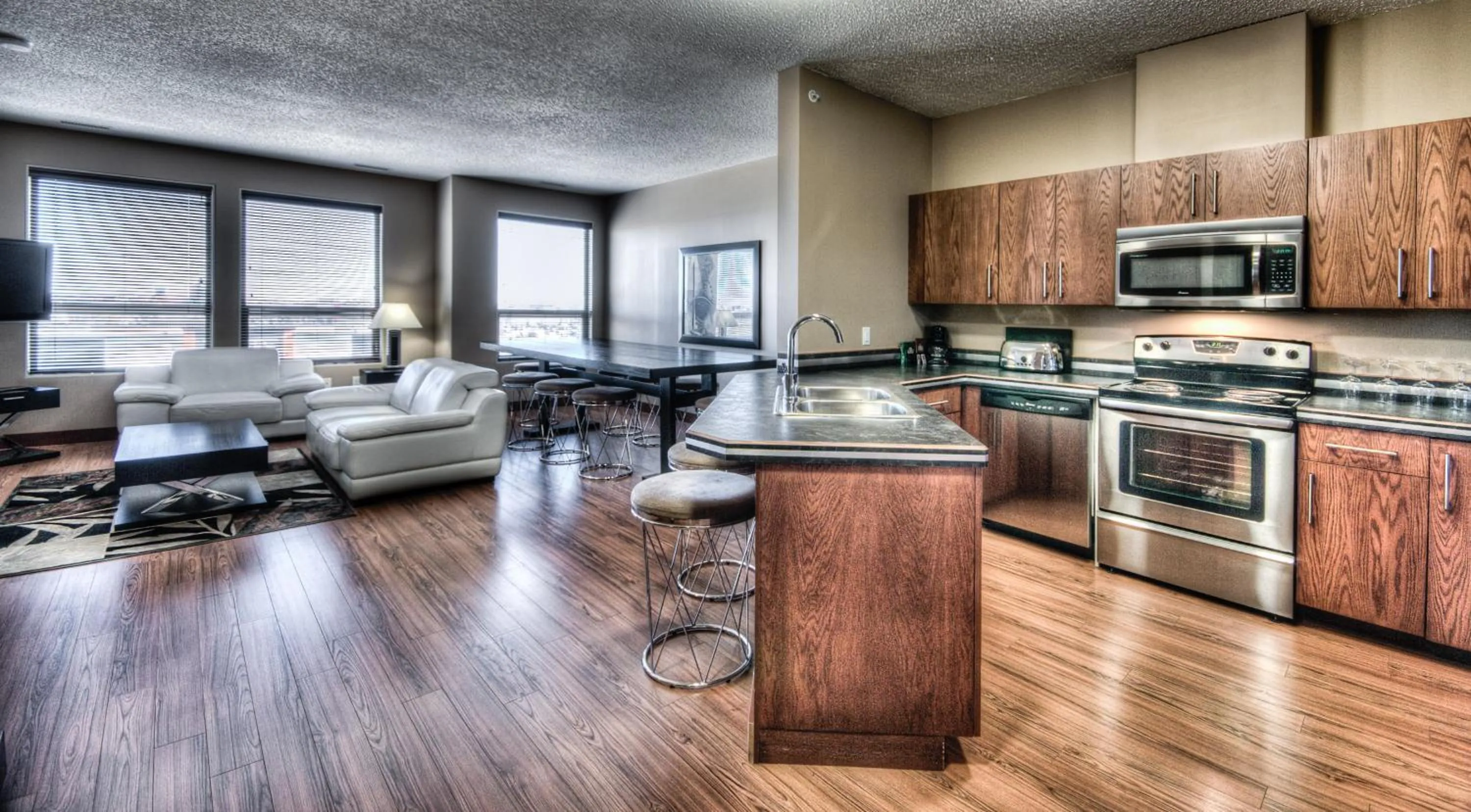 Kitchen or kitchenette in Grand Inn & Residence- Grande Prairie
