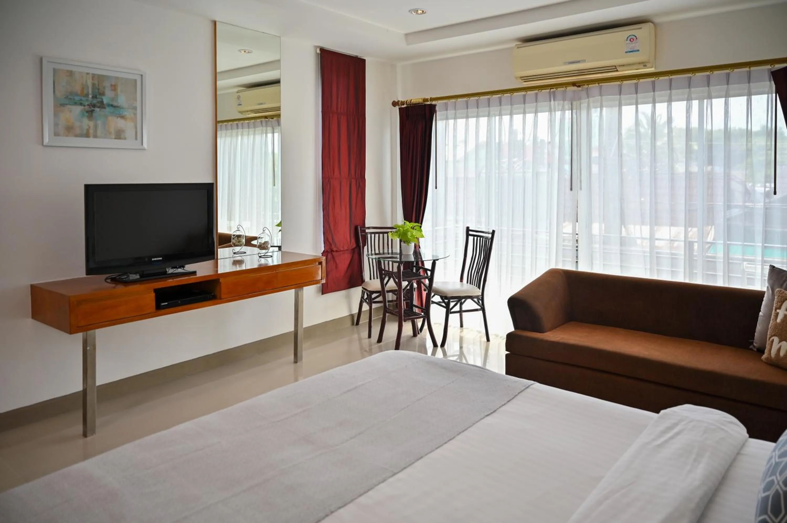 Seating area, Bed in Sivana Place Phuket