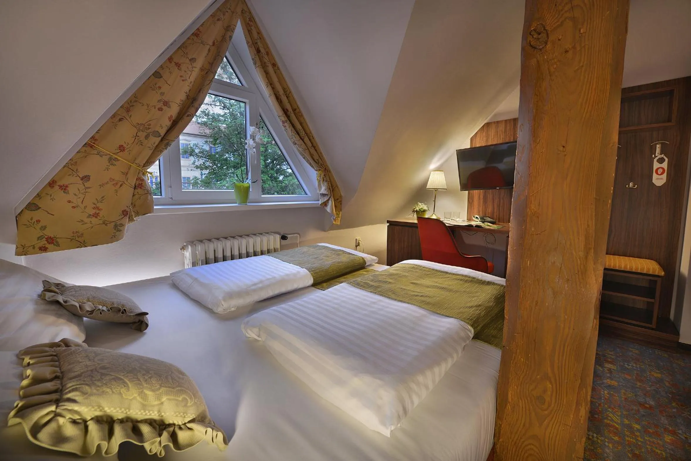 Bed in Maxmilian Lifestyle Resort