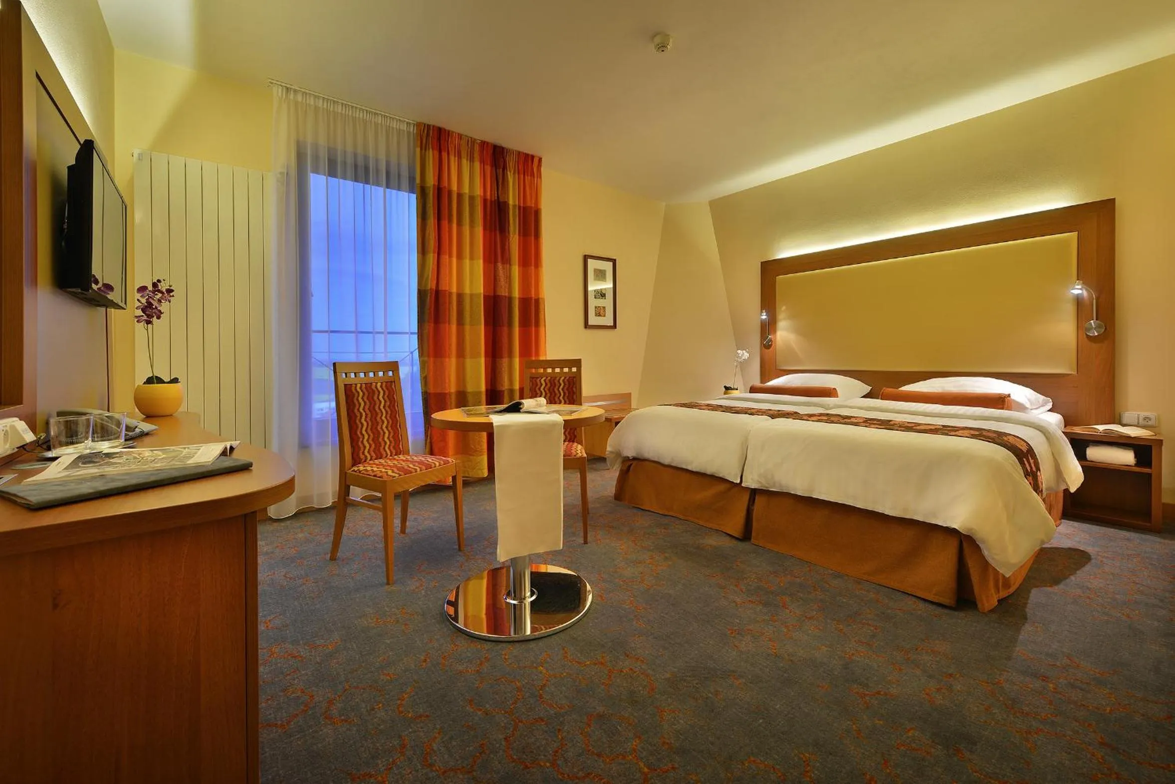 Bed in Maxmilian Lifestyle Resort