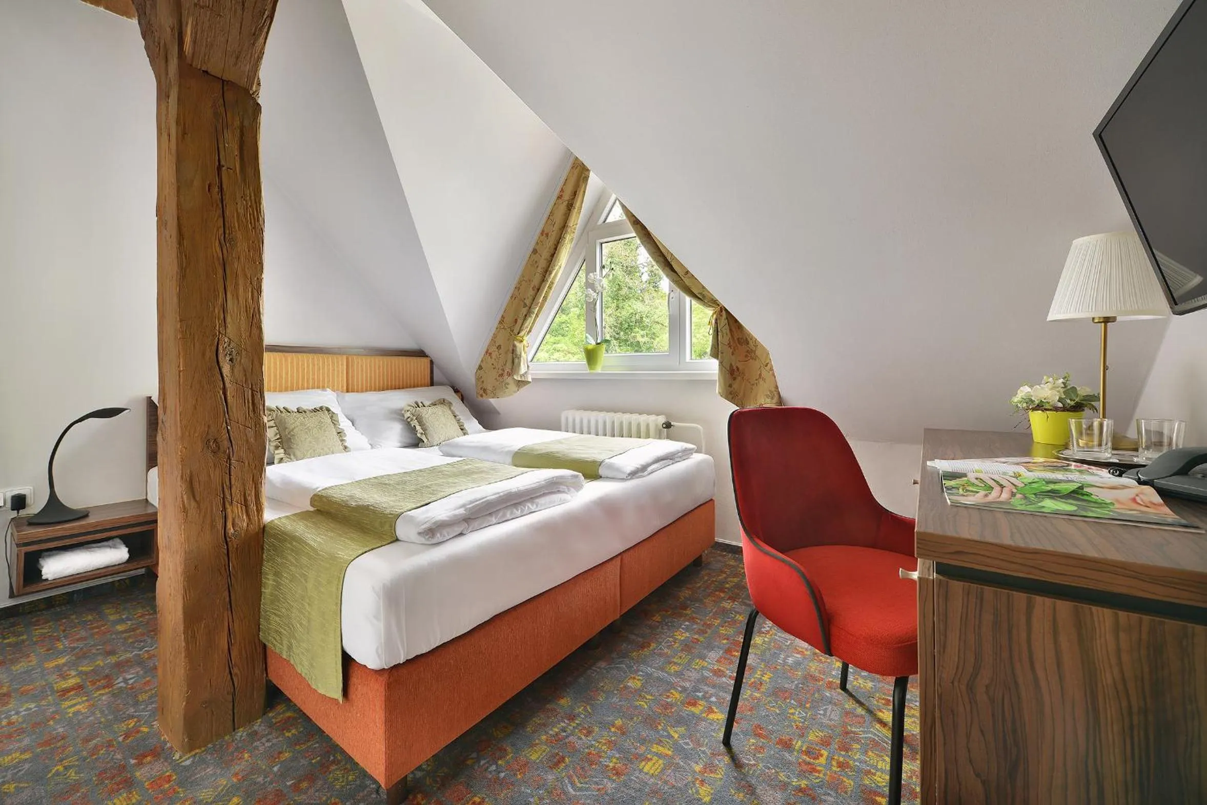 Bed in Maxmilian Lifestyle Resort