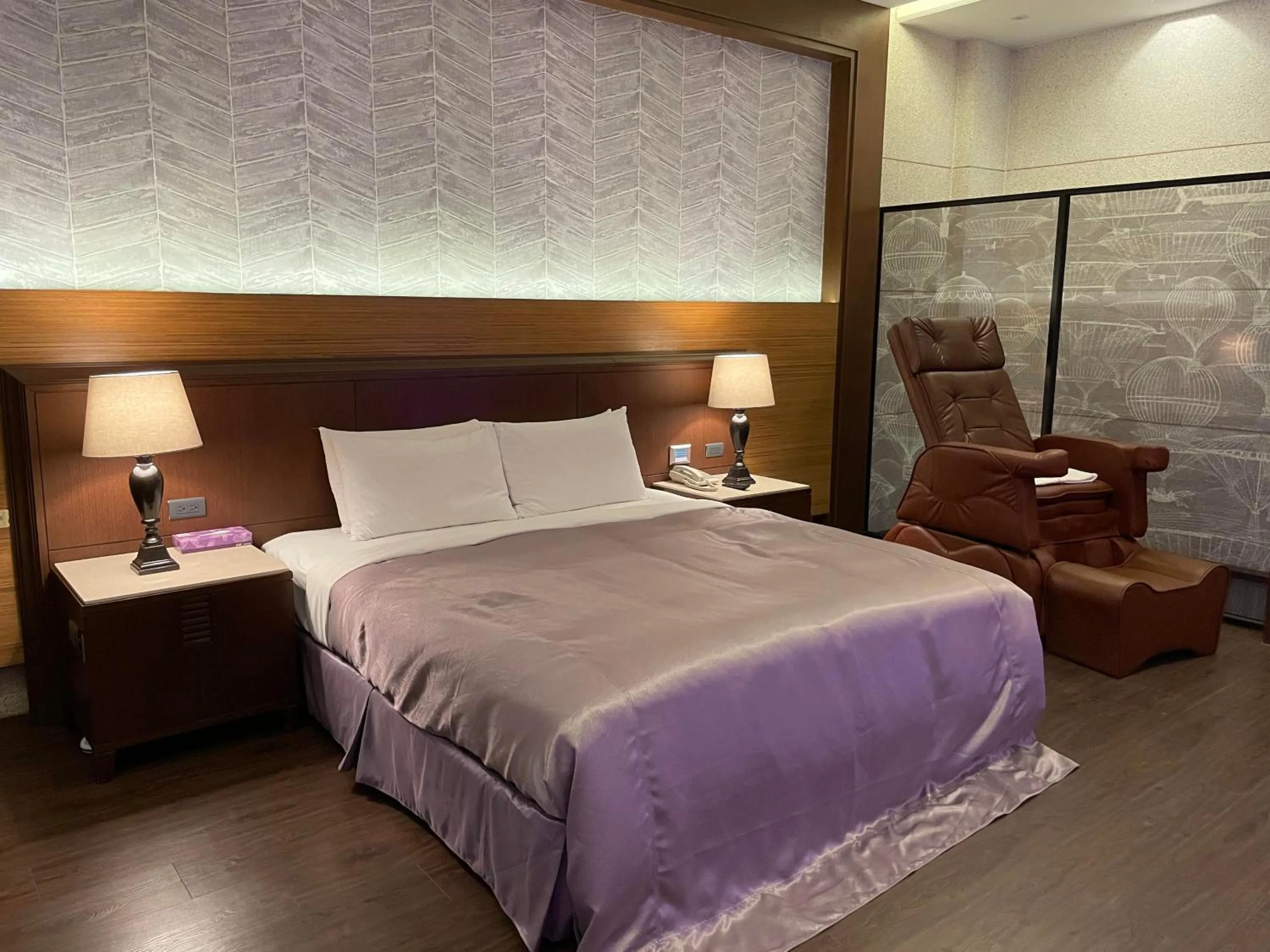 Bed in Purple Garden Motel