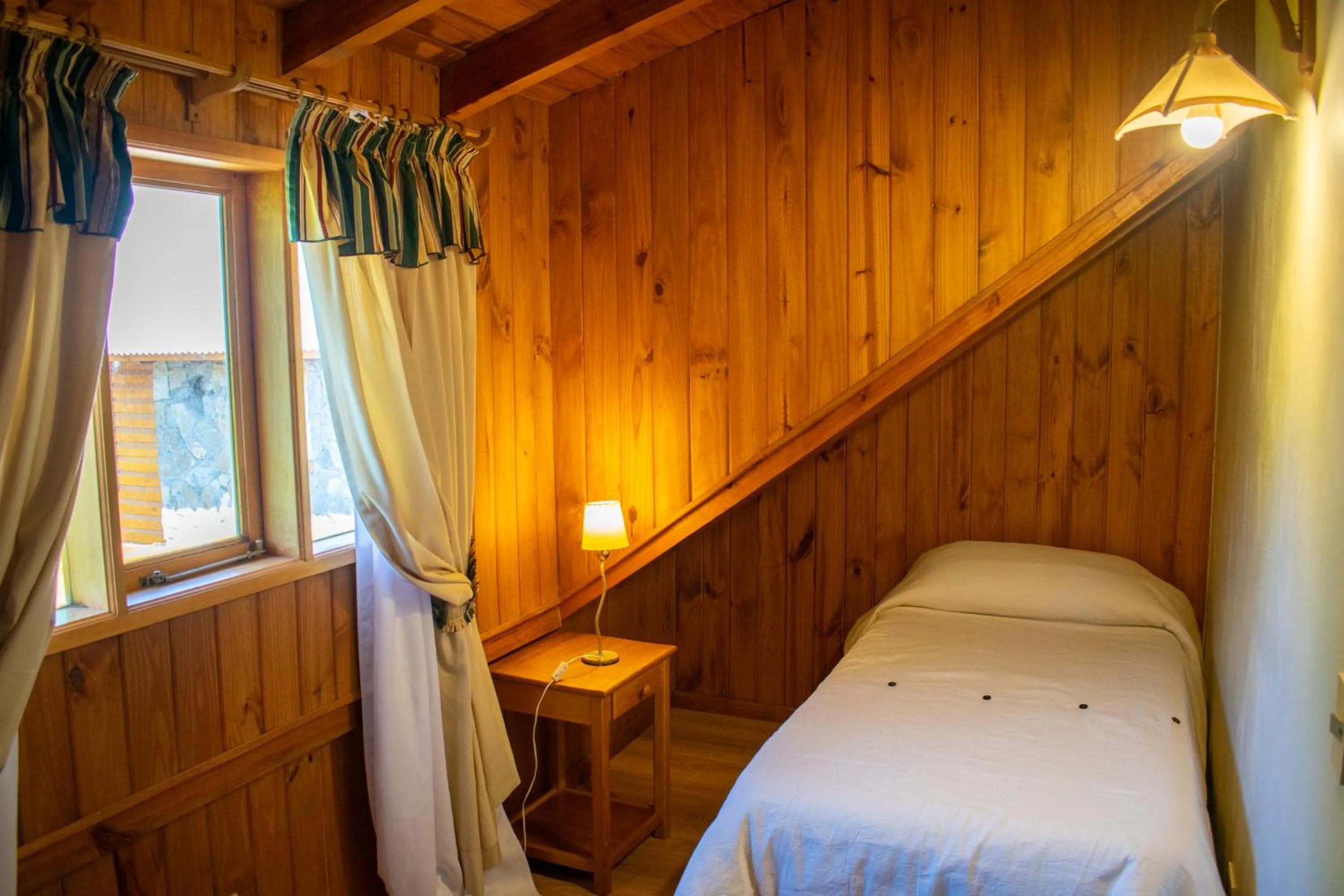 Bed in Hosteria y Cabañas Posada Quinen