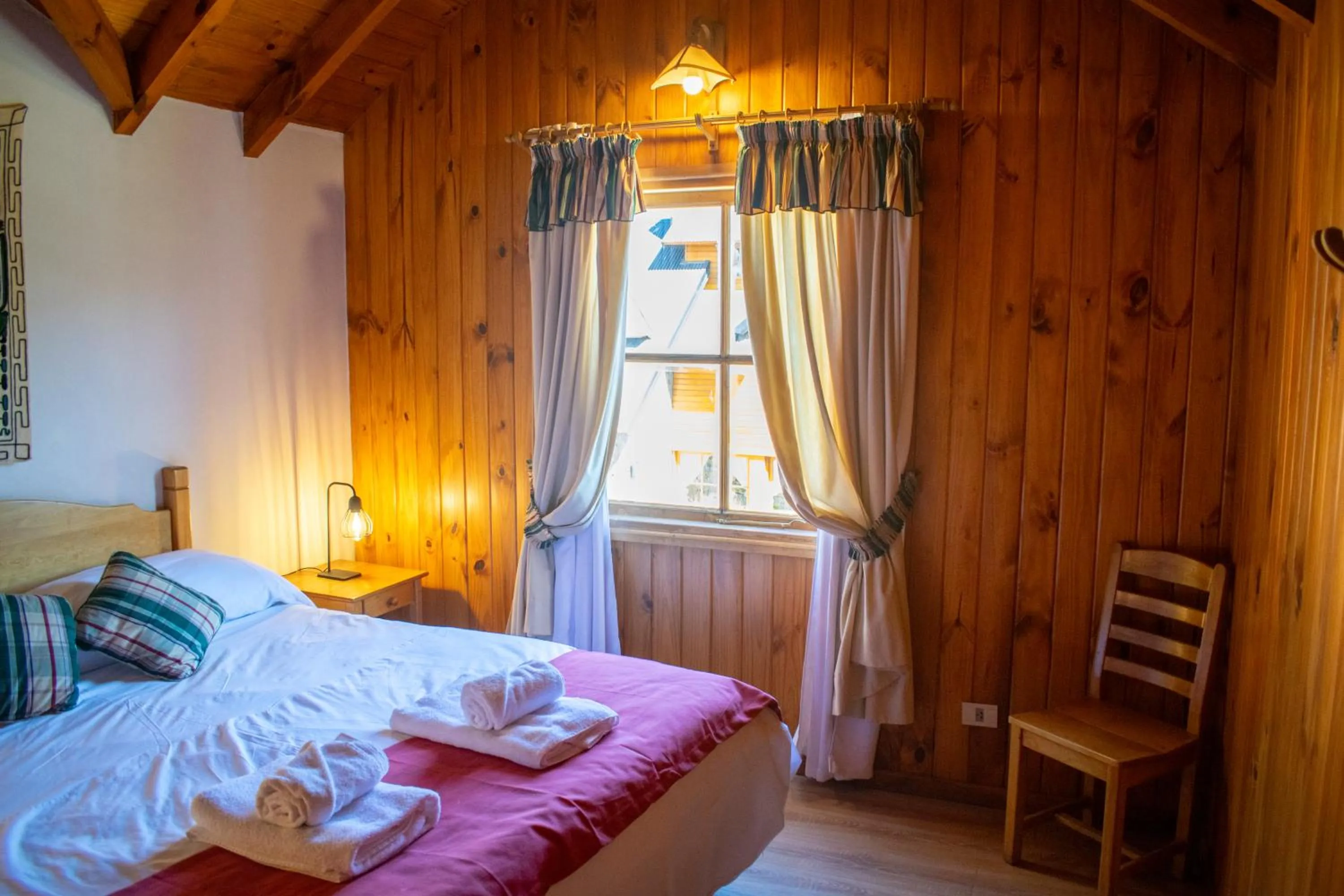 Bed in Hosteria y Cabañas Posada Quinen