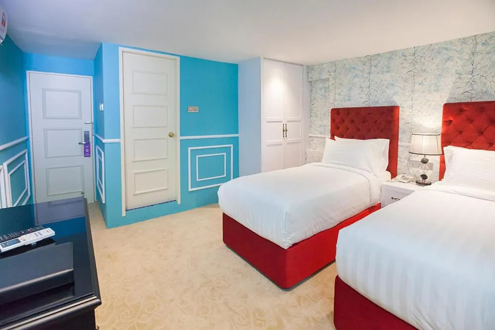 Bed in Apple Heritage Hotel