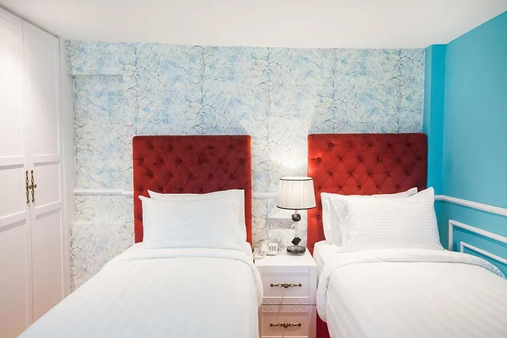 Bed in Apple Heritage Hotel