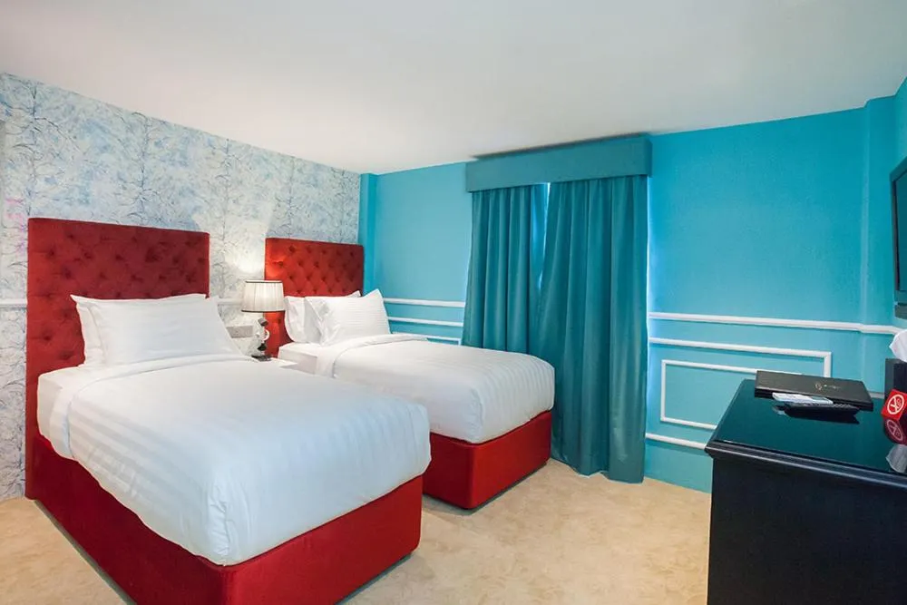 Bed in Apple Heritage Hotel