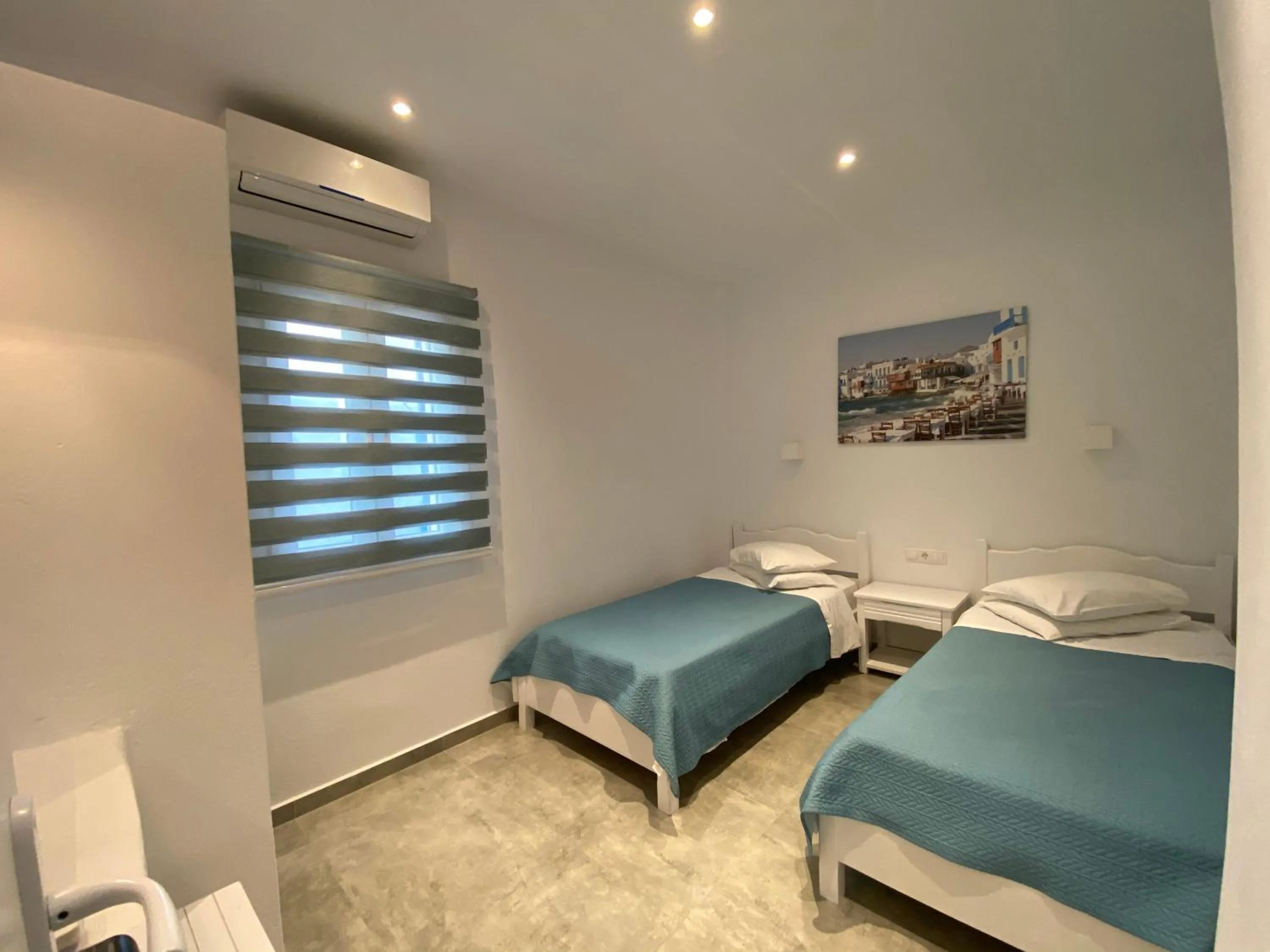 Bed in Anemos Hotel & Apartments