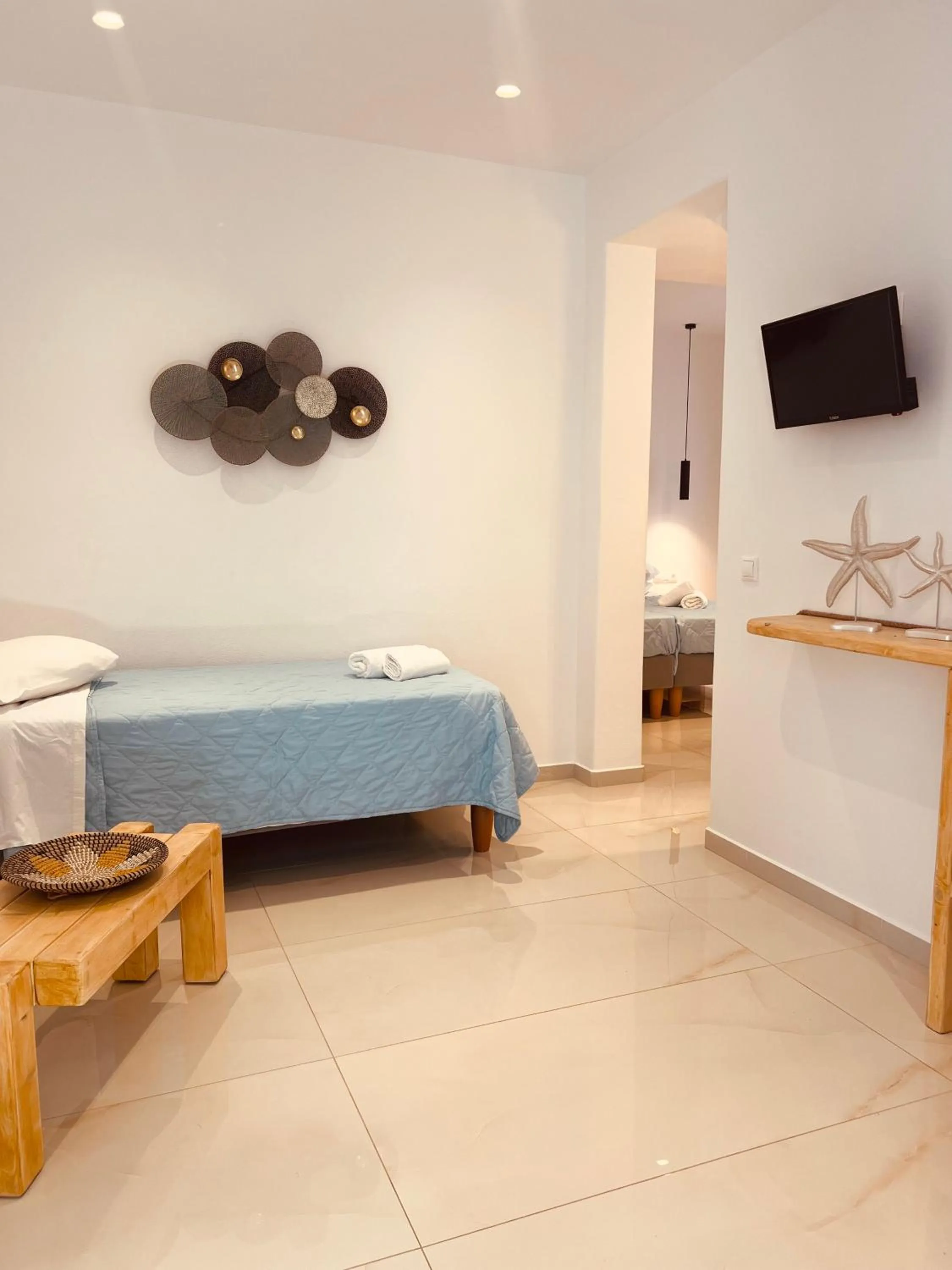 Bed in Anemos Hotel & Apartments