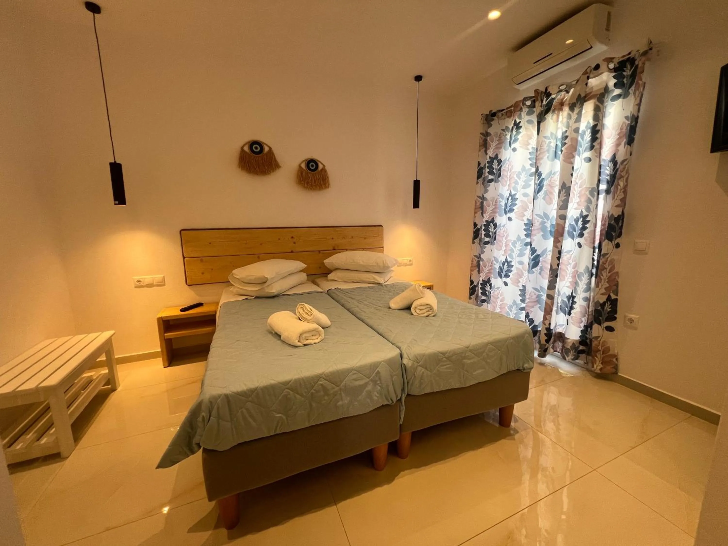 Bed in Anemos Hotel & Apartments