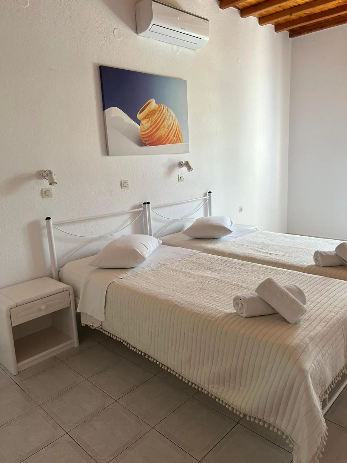 Bed in Anemos Hotel & Apartments
