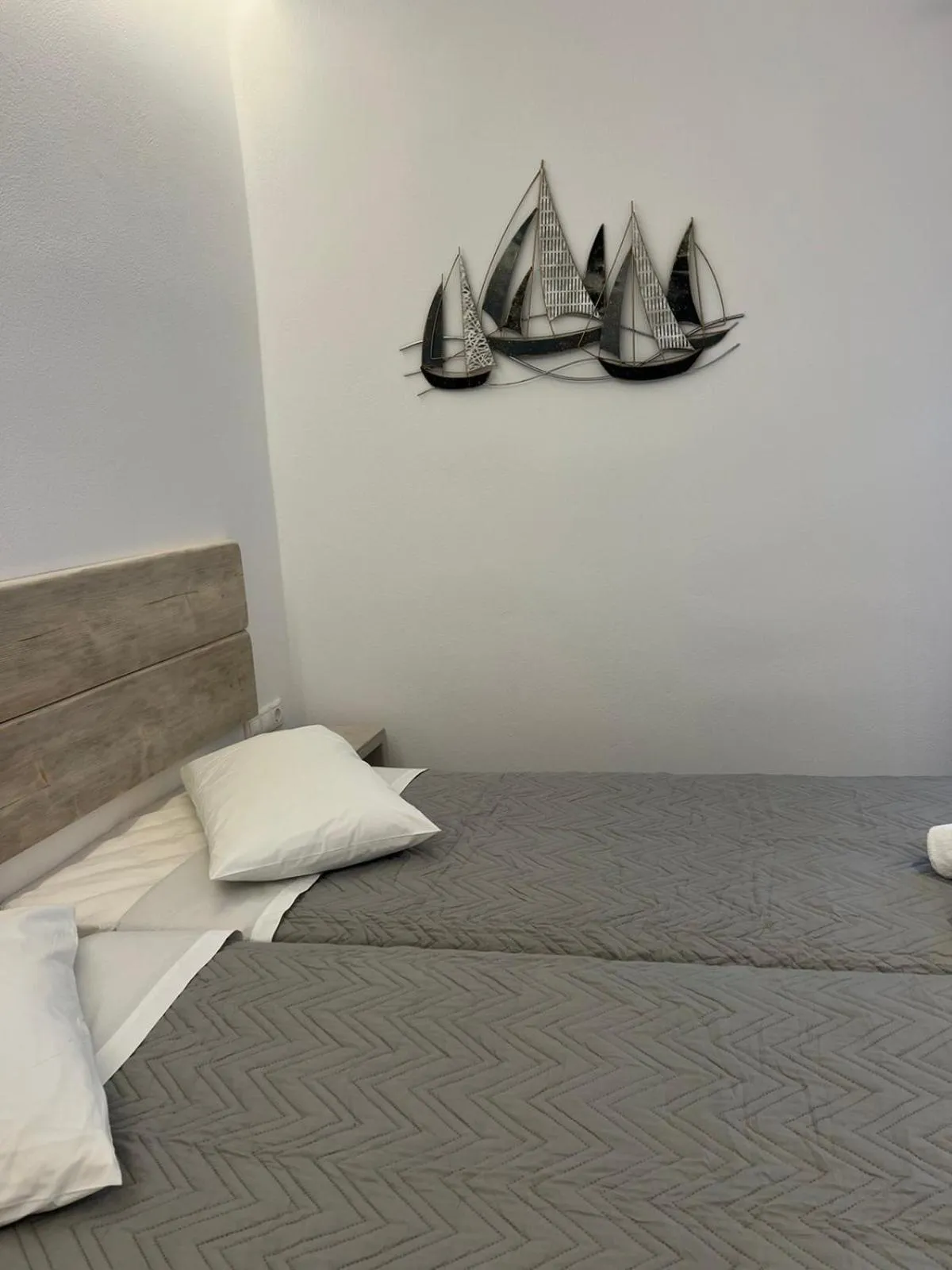 Bed in Anemos Hotel & Apartments