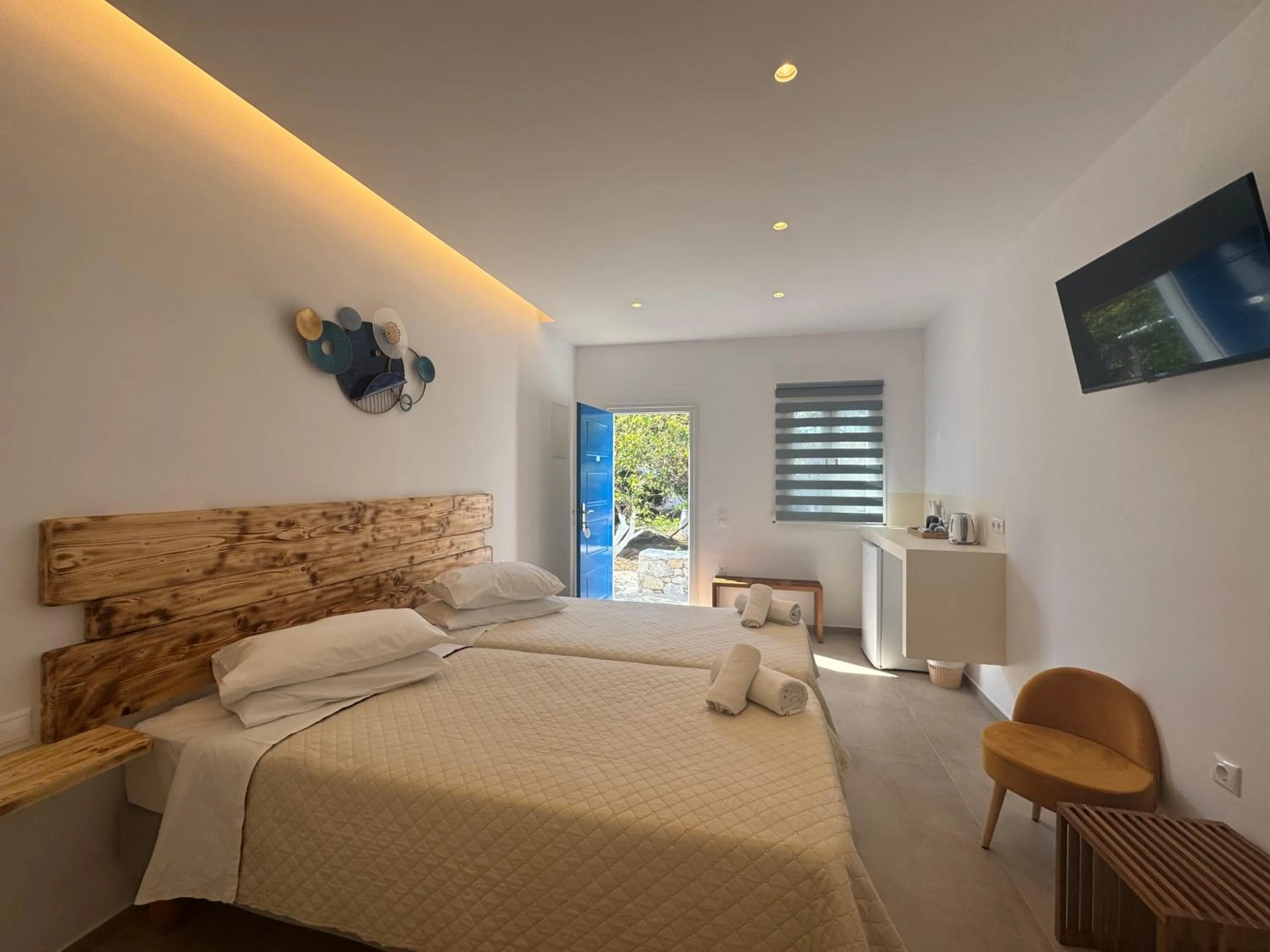 Bed in Anemos Hotel & Apartments