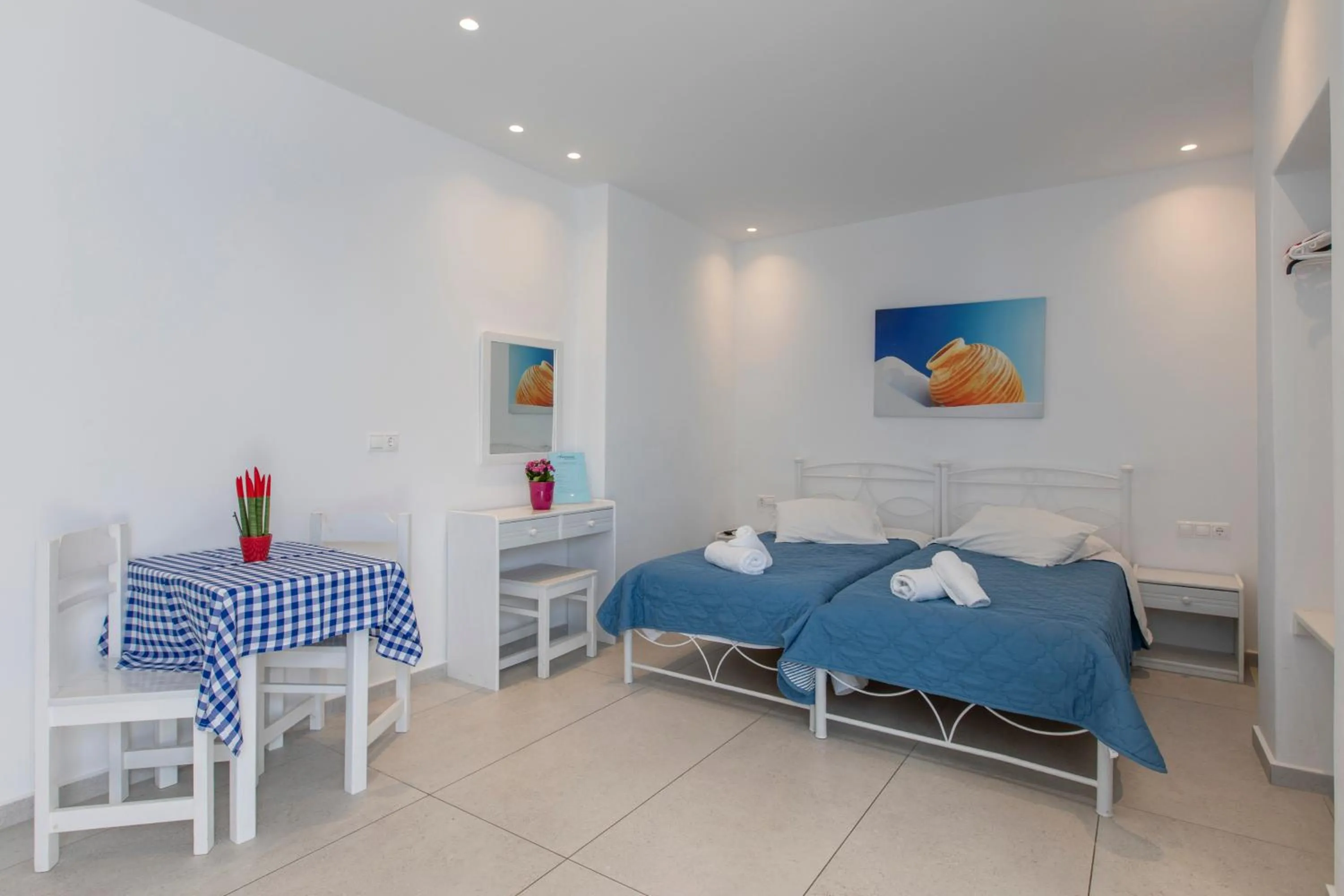 Bed in Anemos Hotel & Apartments