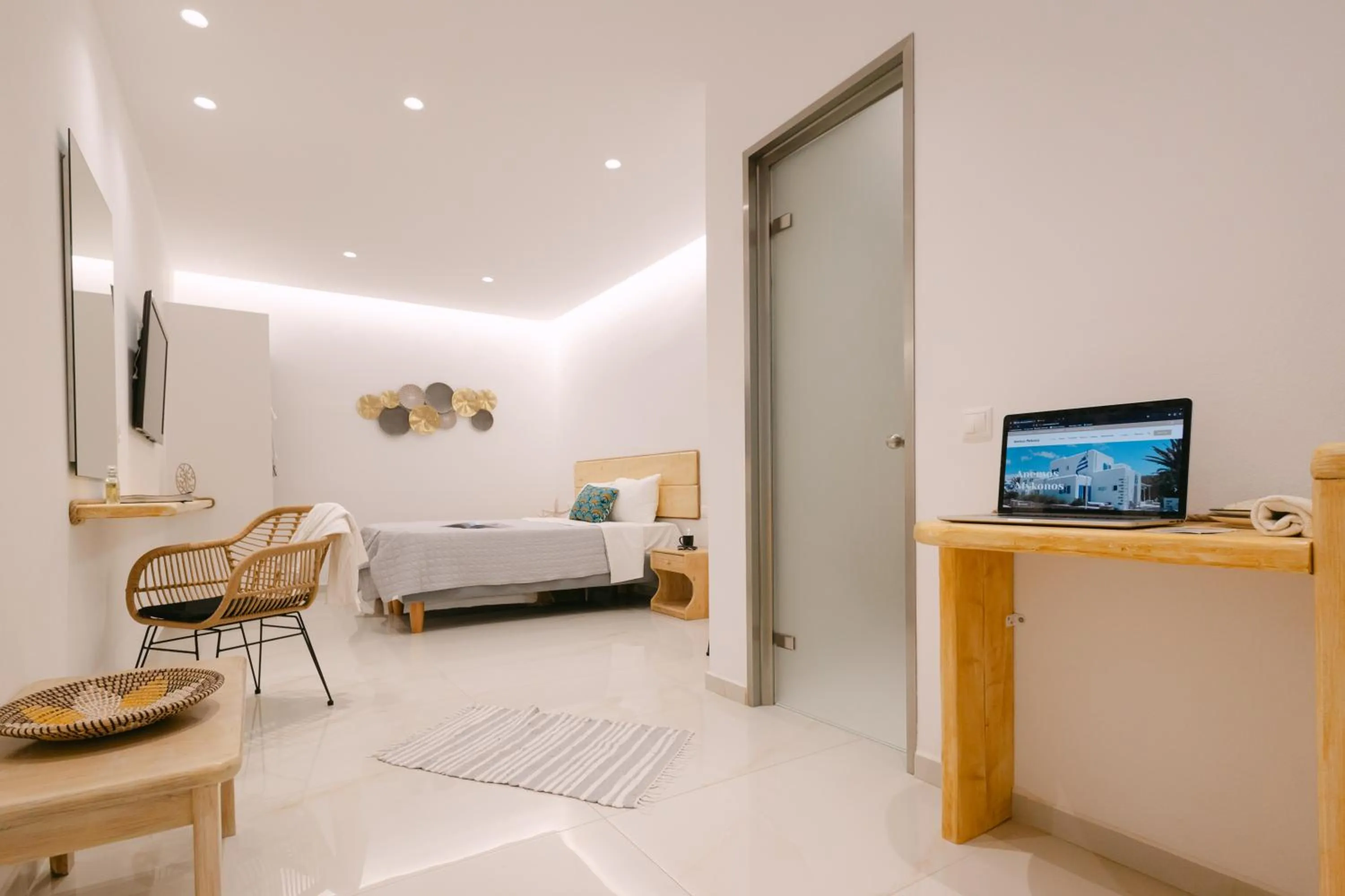 Bed in Anemos Hotel & Apartments