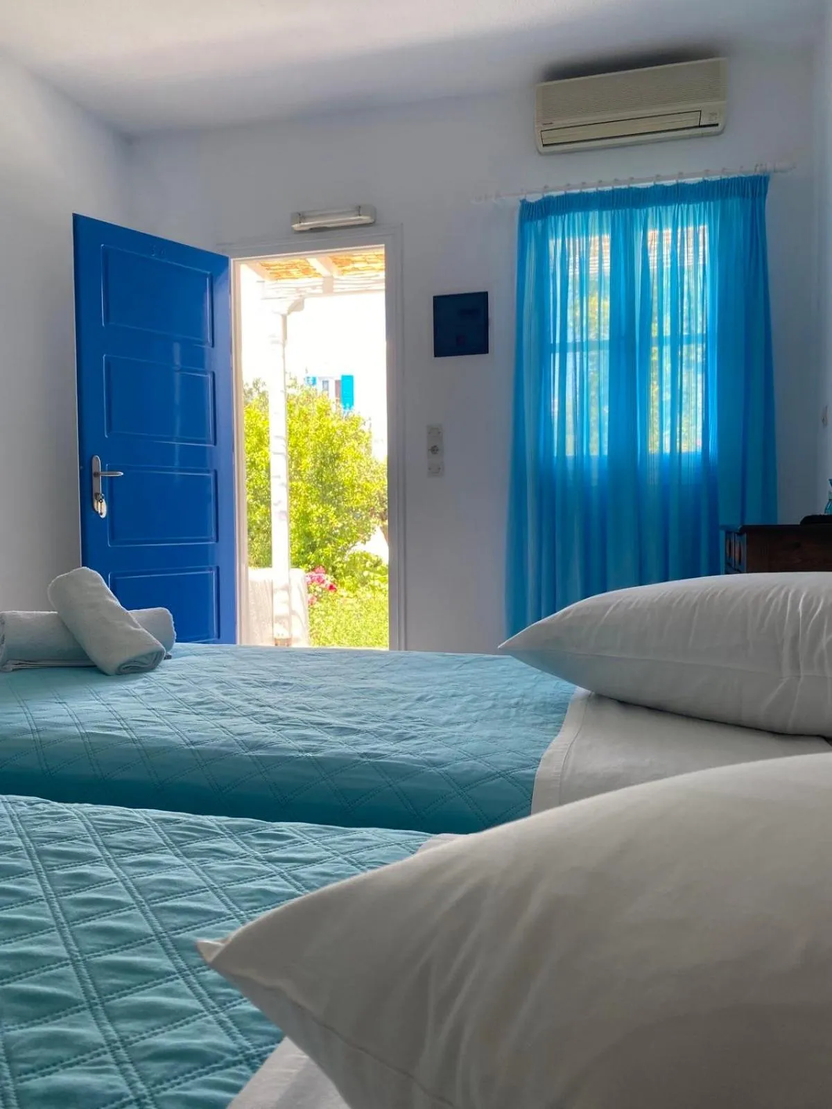 Bed in Anemos Hotel & Apartments