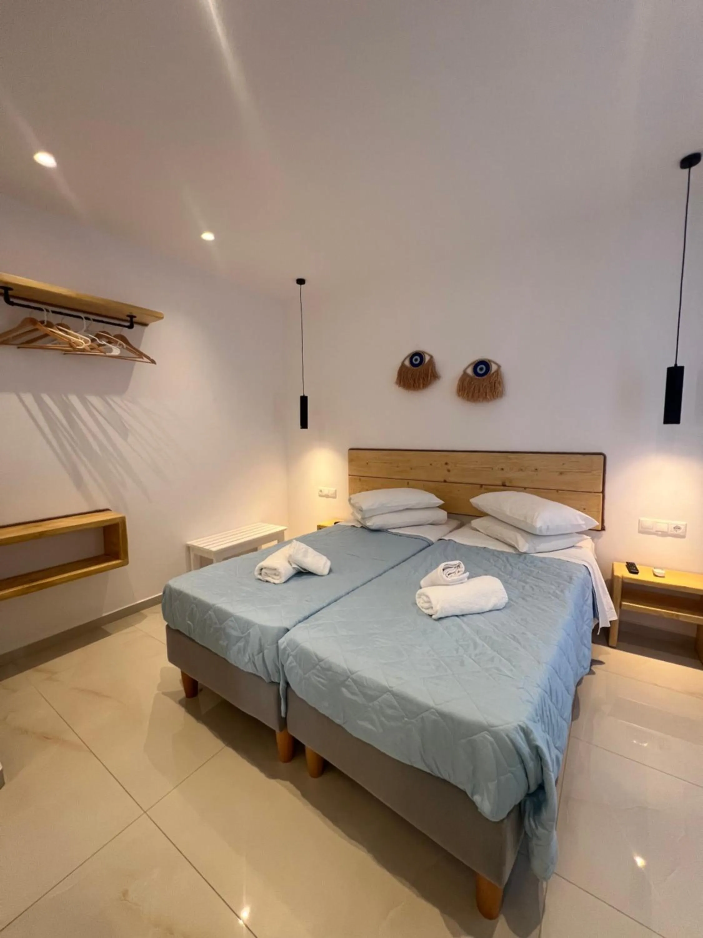 Bed in Anemos Hotel & Apartments