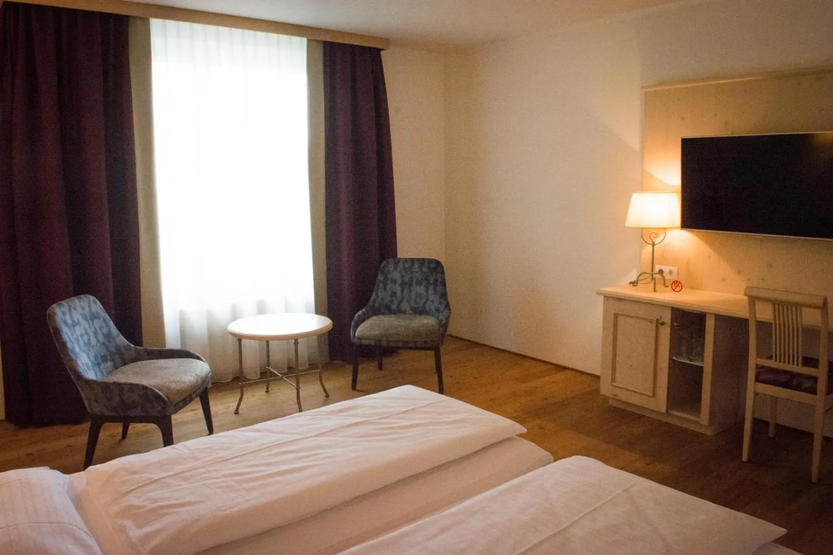 Seating area, Bed in Hotel Krone Langenegg