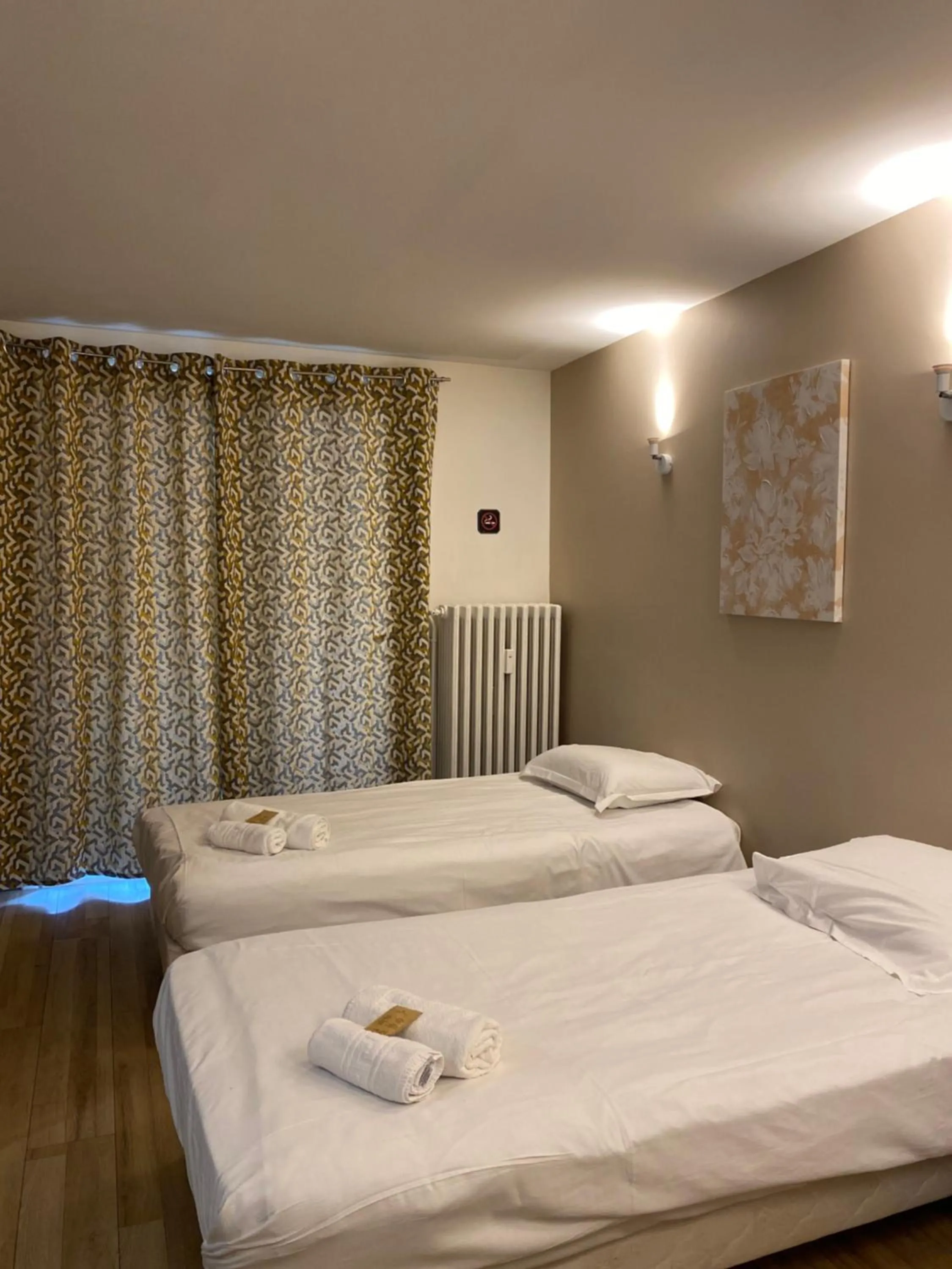 Bed in Hôtel des Beaux Arts