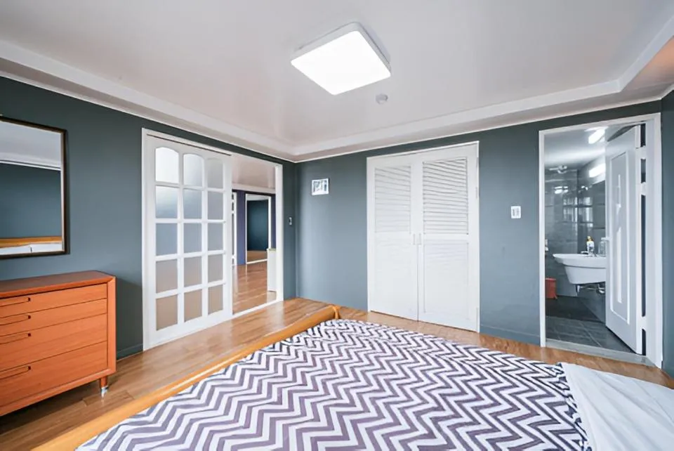 Bed in jeju Tovice Condo Ocean