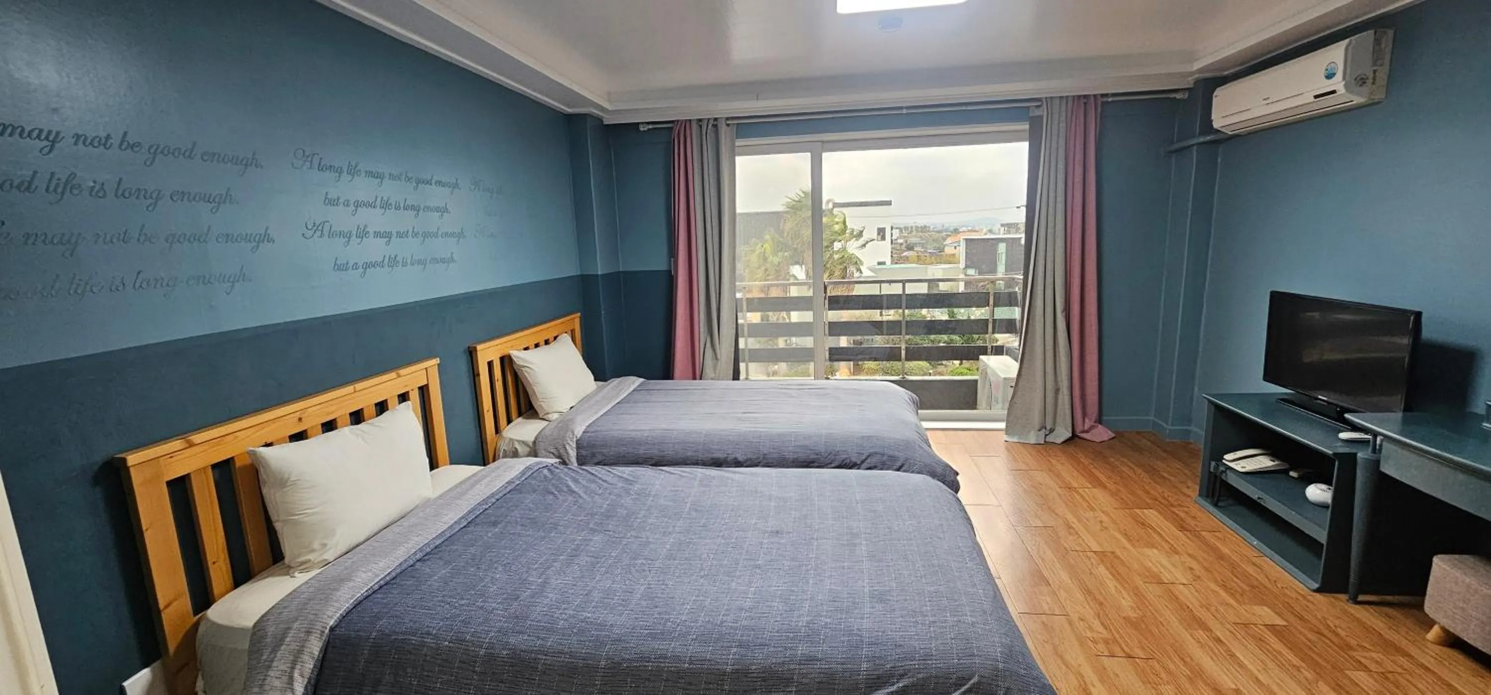 Bed in jeju Tovice Condo Ocean