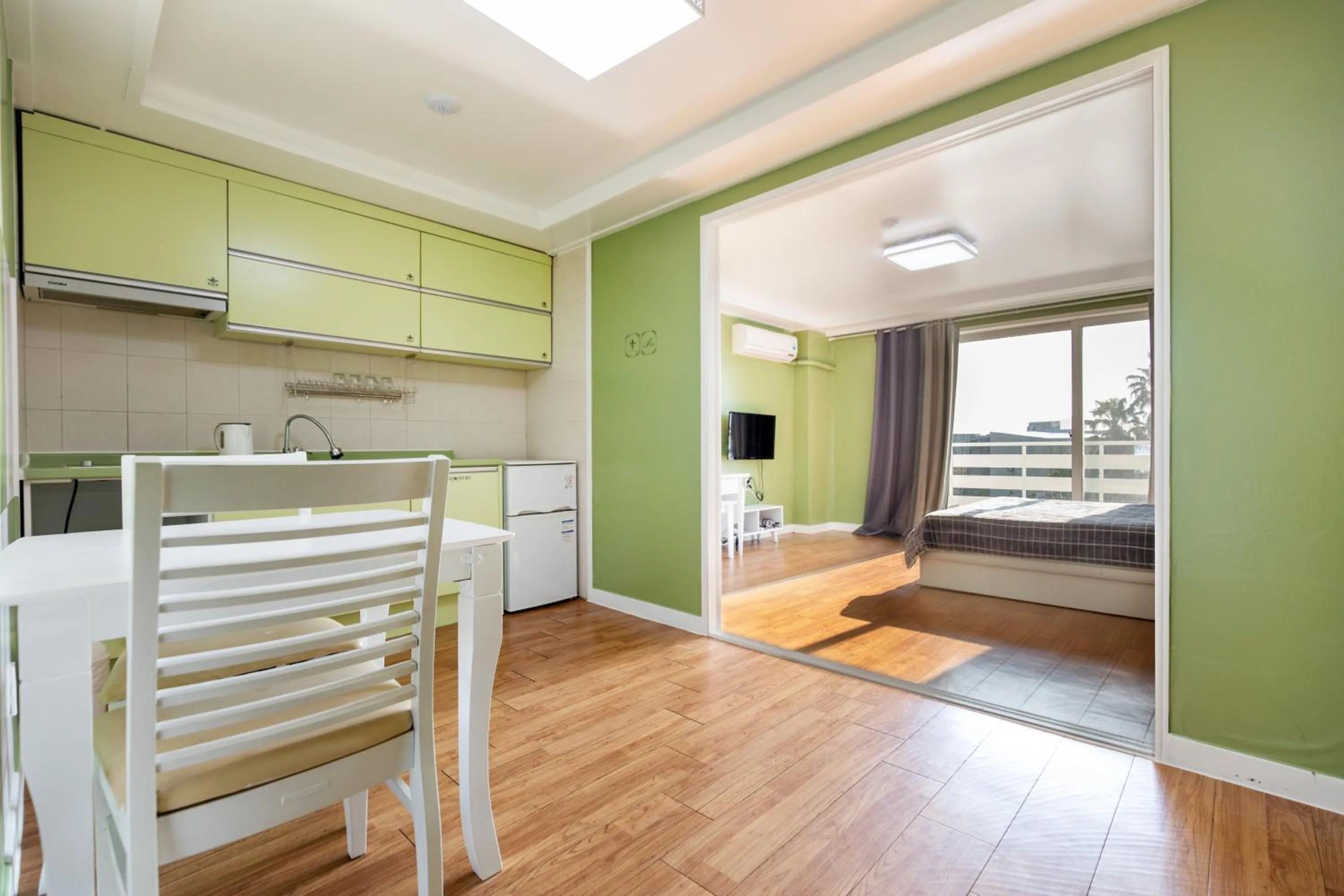 Bed in jeju Tovice Condo Ocean