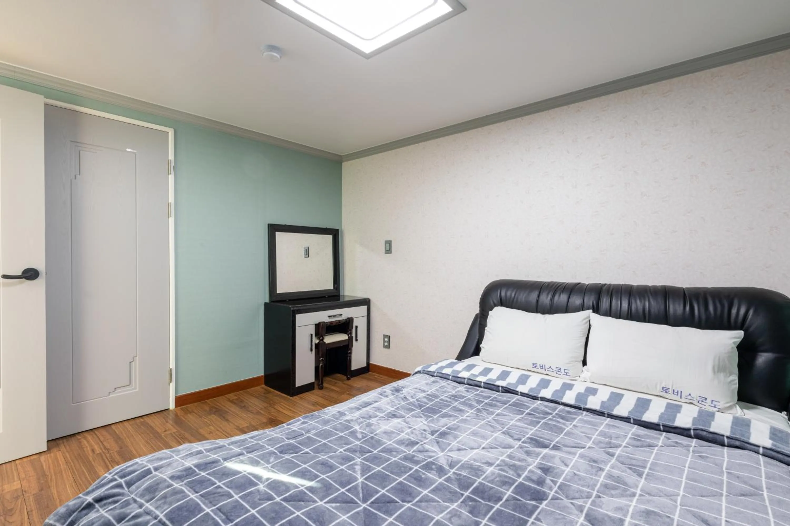 Bed in jeju Tovice Condo Ocean