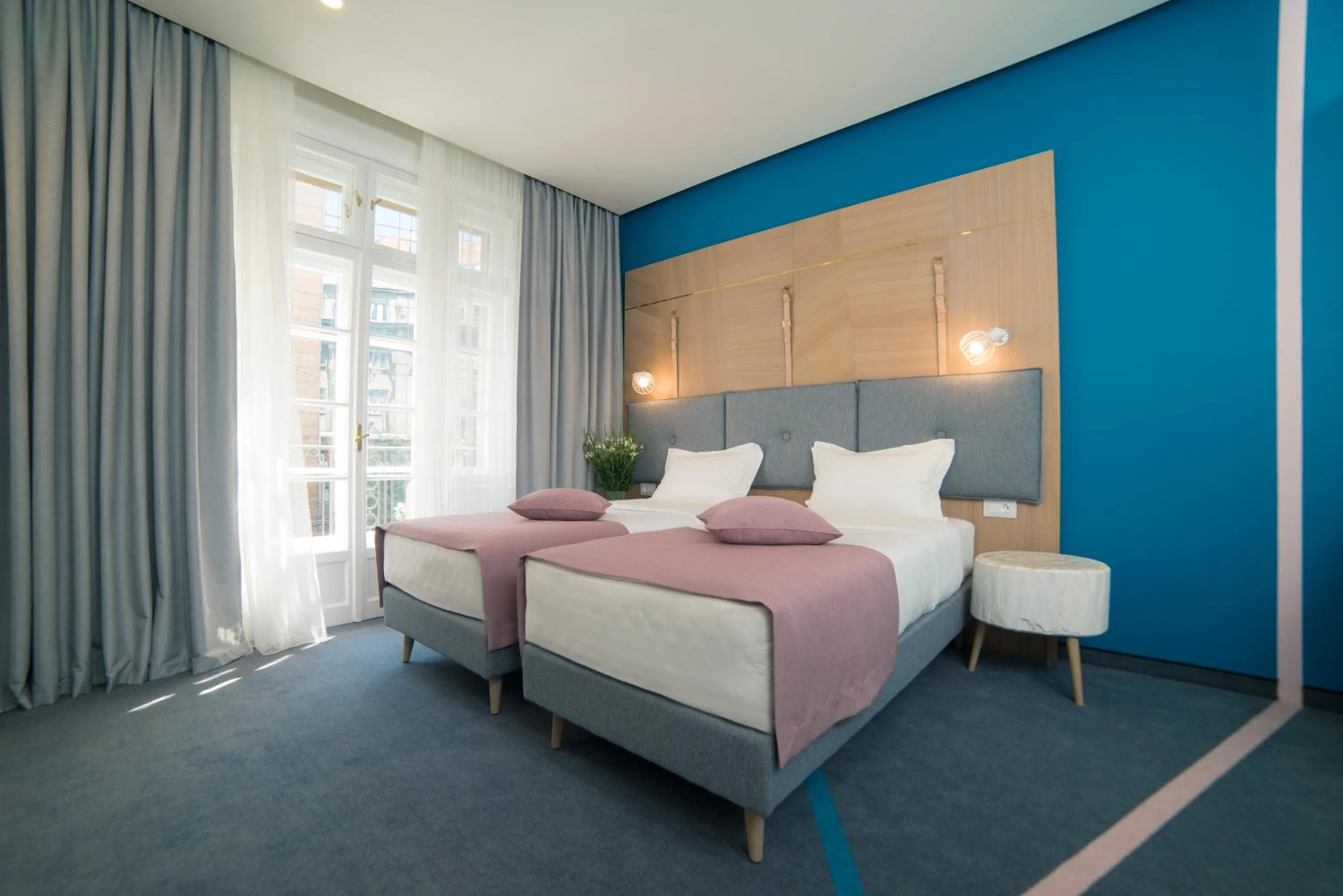 Bed in City Nest Modern & Cozy Suites