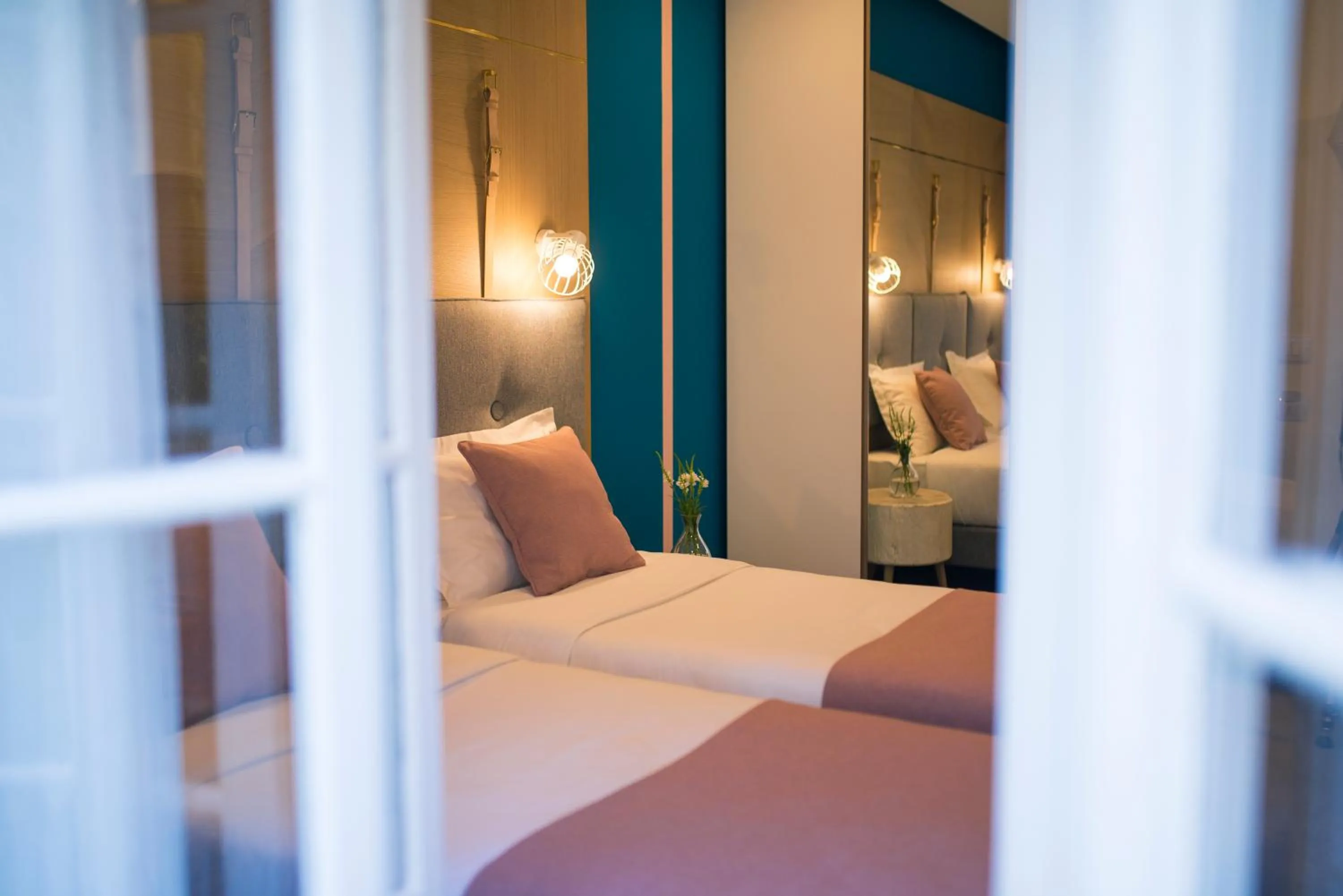 Bed in City Nest Modern & Cozy Suites